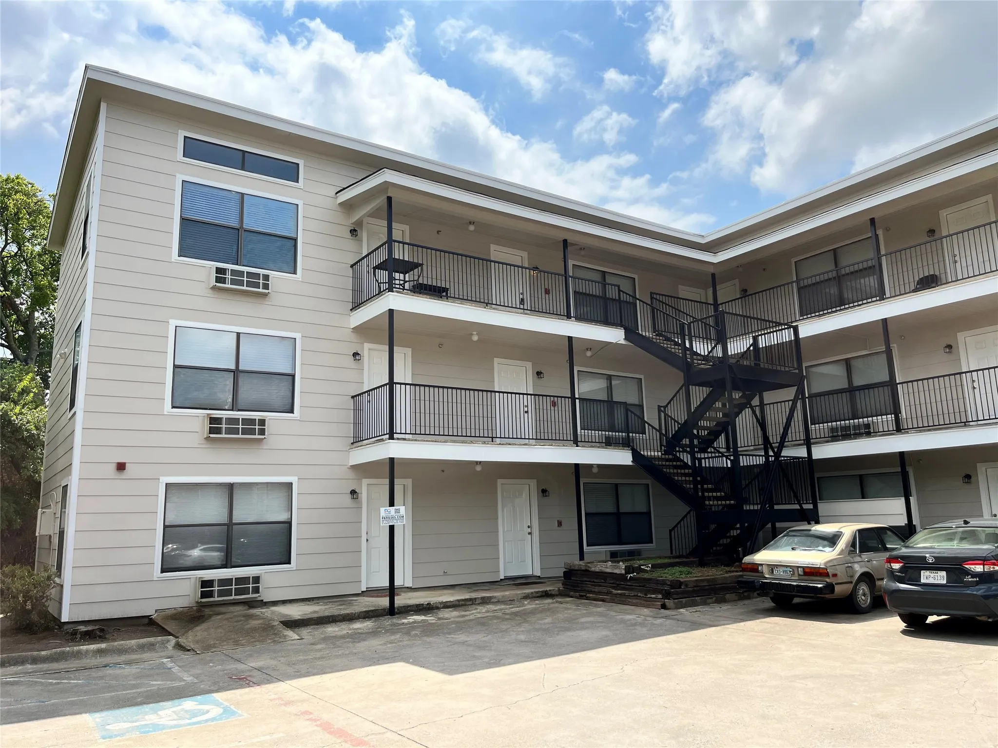 Additional exterior angle showcasing the building's architecture and well-kept common areas.