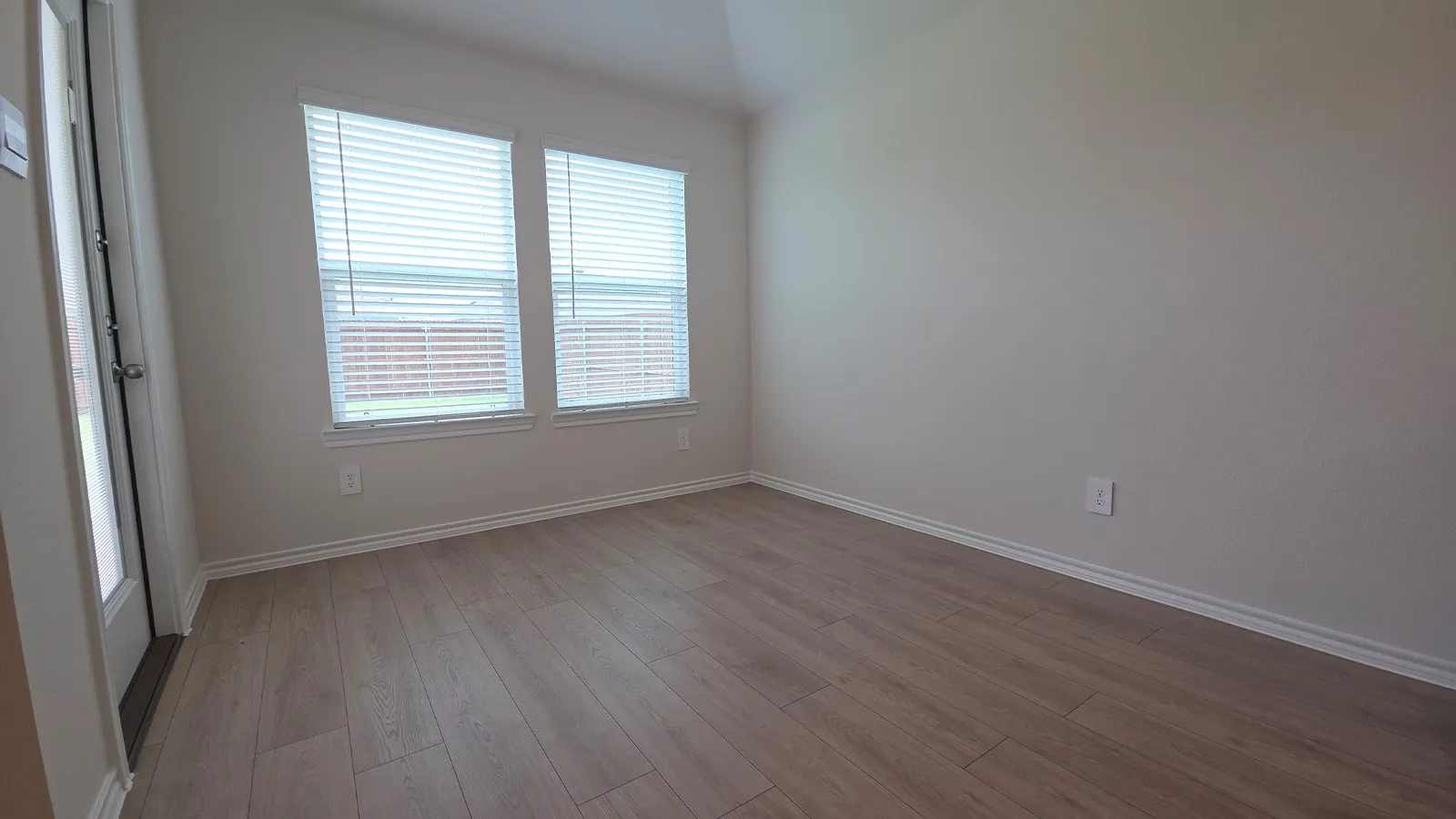 Interior space featuring wood-finish flooring and neutral wall tones