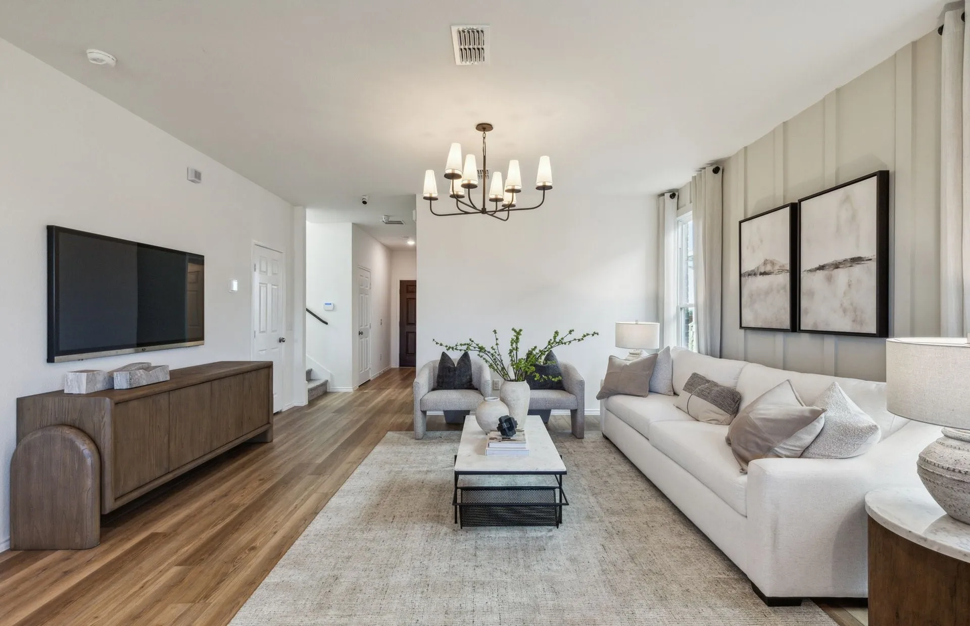 *Model Representation - Spacious gathering room with large windows