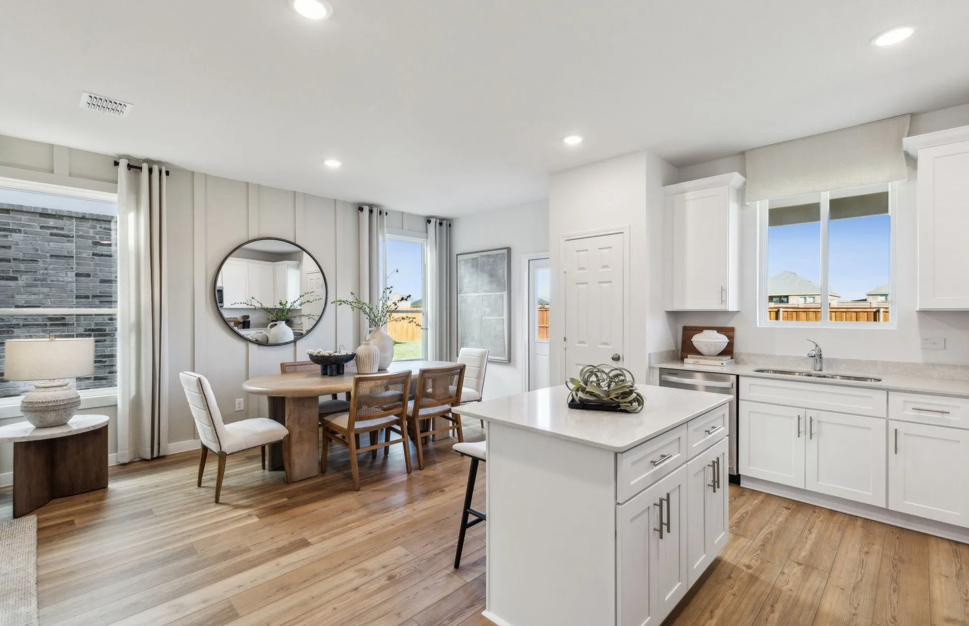 *Model Representation - Large island overlooking gathering room and dining areas