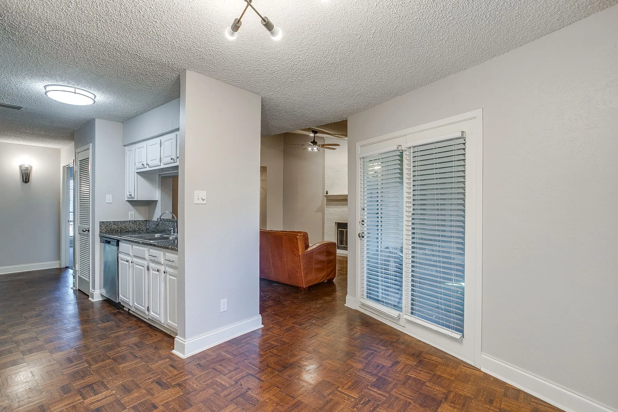 Wood-finish flooring throughout, complemented by light gray walls and white baseboards