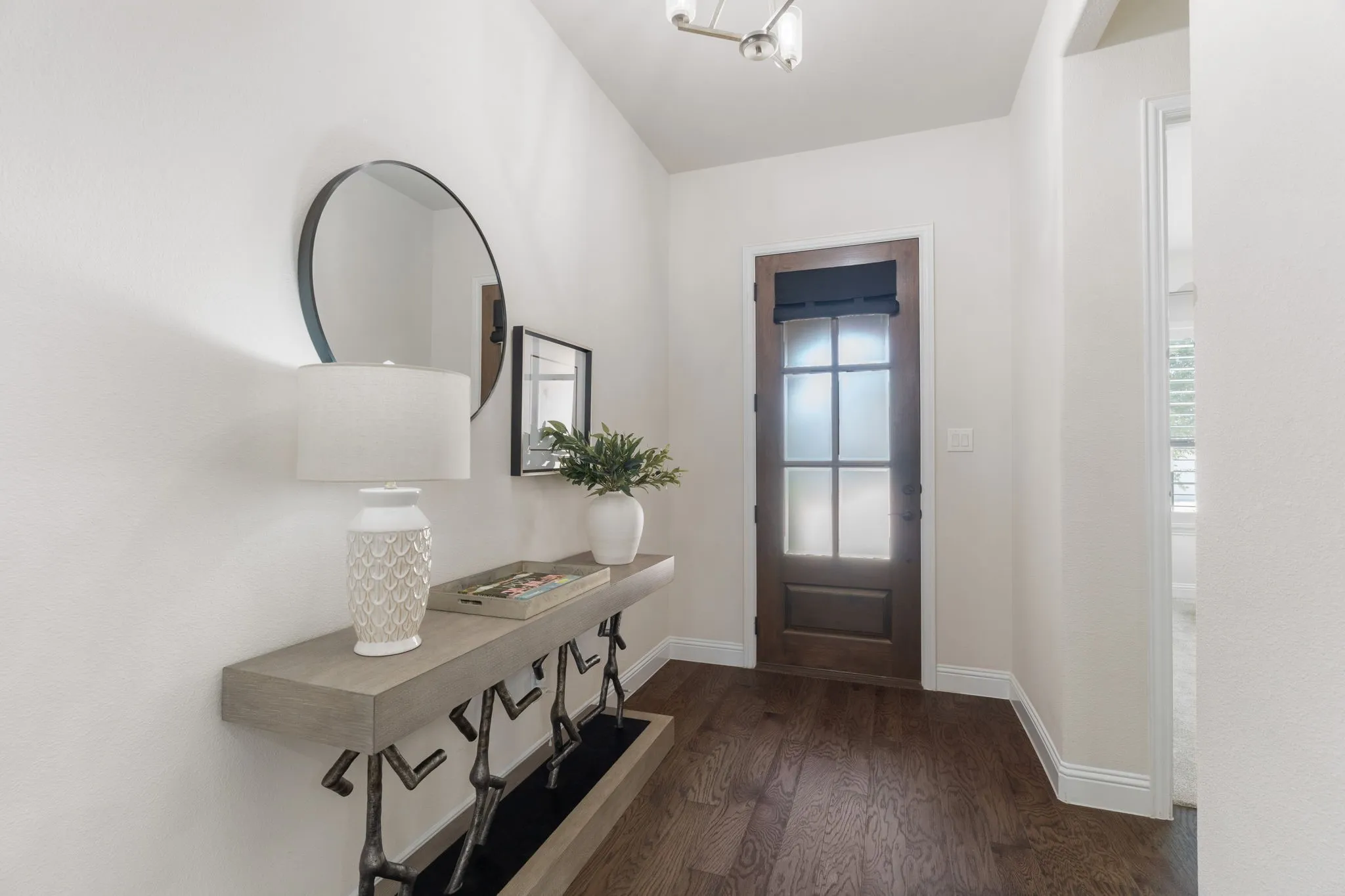 High ceilings & Mohawk wood floors expand from the entry through the kitchen, dining area, living room + the sellers added to the primary bedroom & closet.
