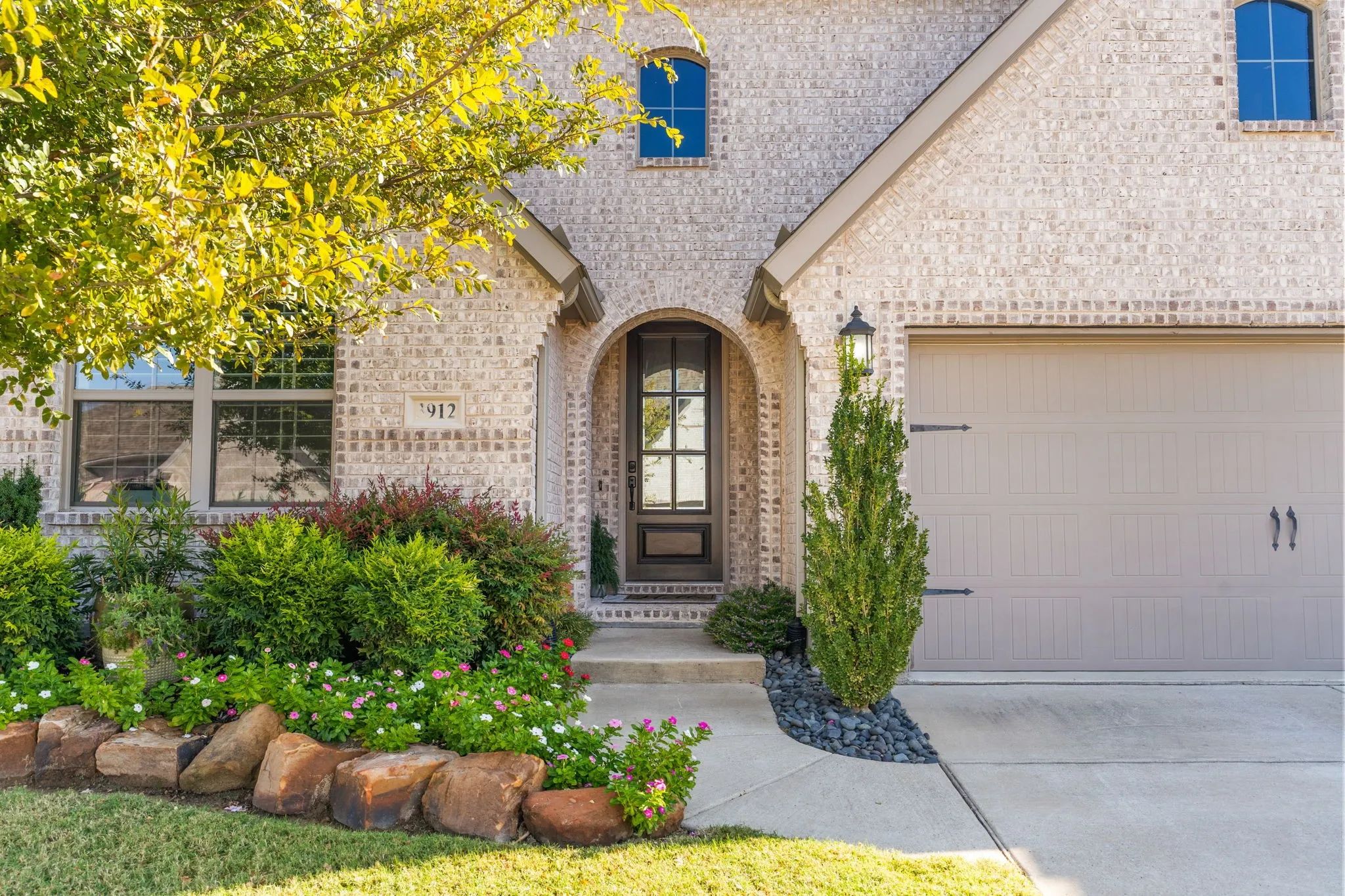 From the pretty wood/glass front door to the beautifully maintained landscaping ~ this home's charming details create memorable curb appeal for vistiors. Come on in, let's take a look!