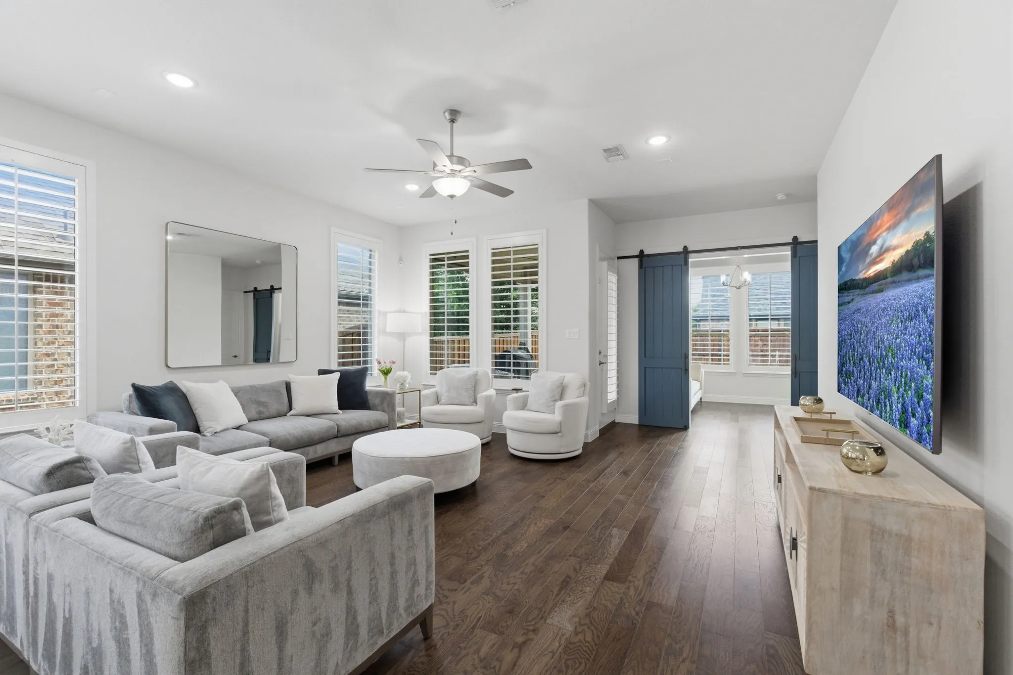 Living space offers inviting views of the covered patio & backyard, creating a natural connection to outdoor living,