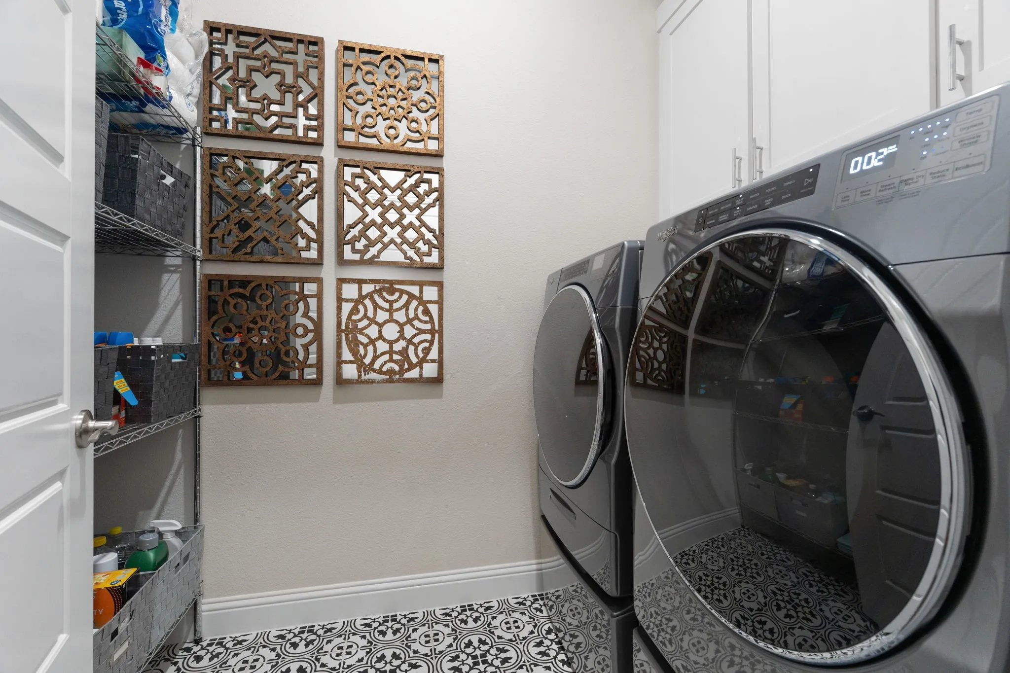 Charming floor tile in the laundry room + room to add your own functional storage organizers if desired.