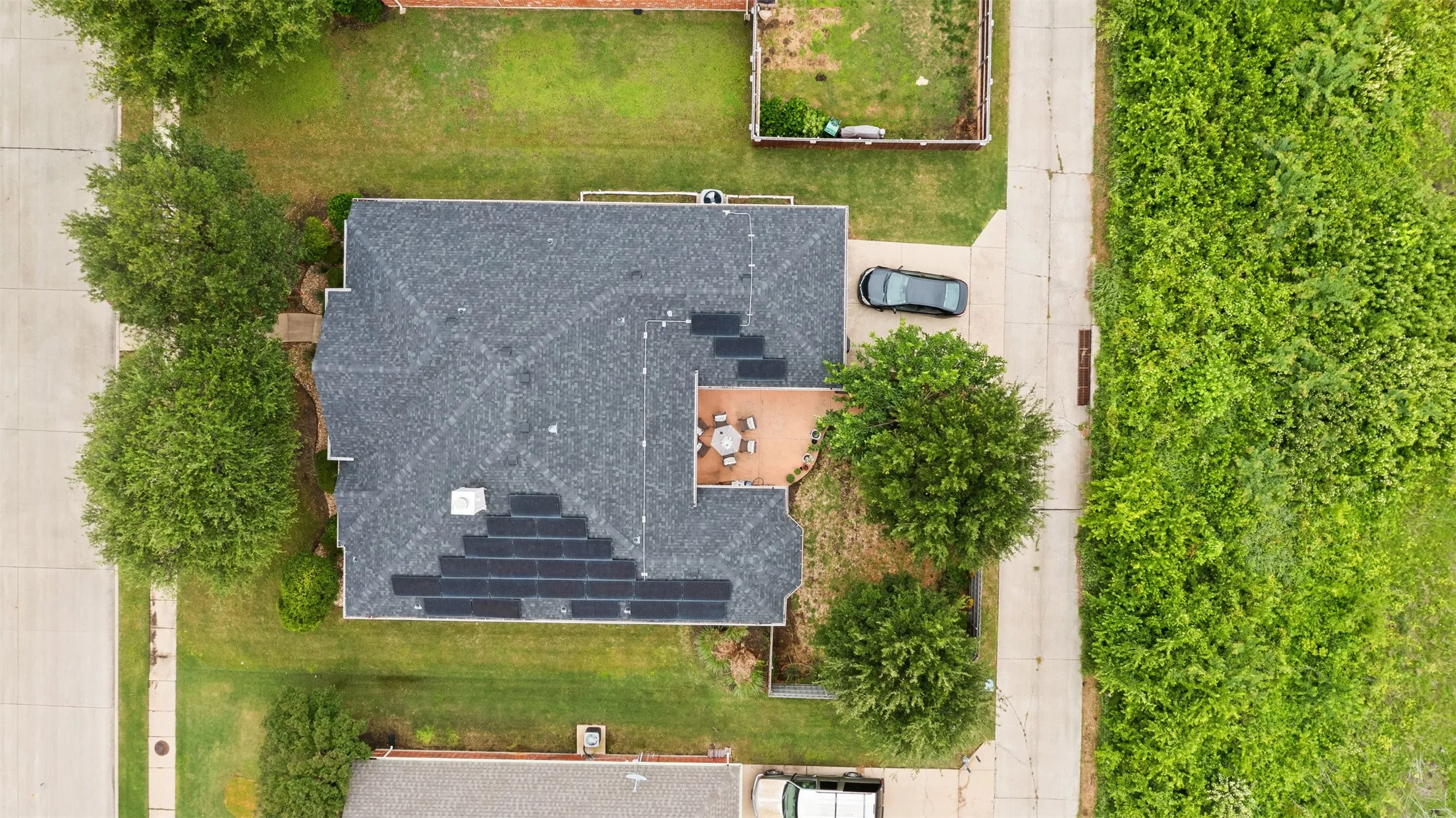 Asphalt shingle roof with integrated solar panels