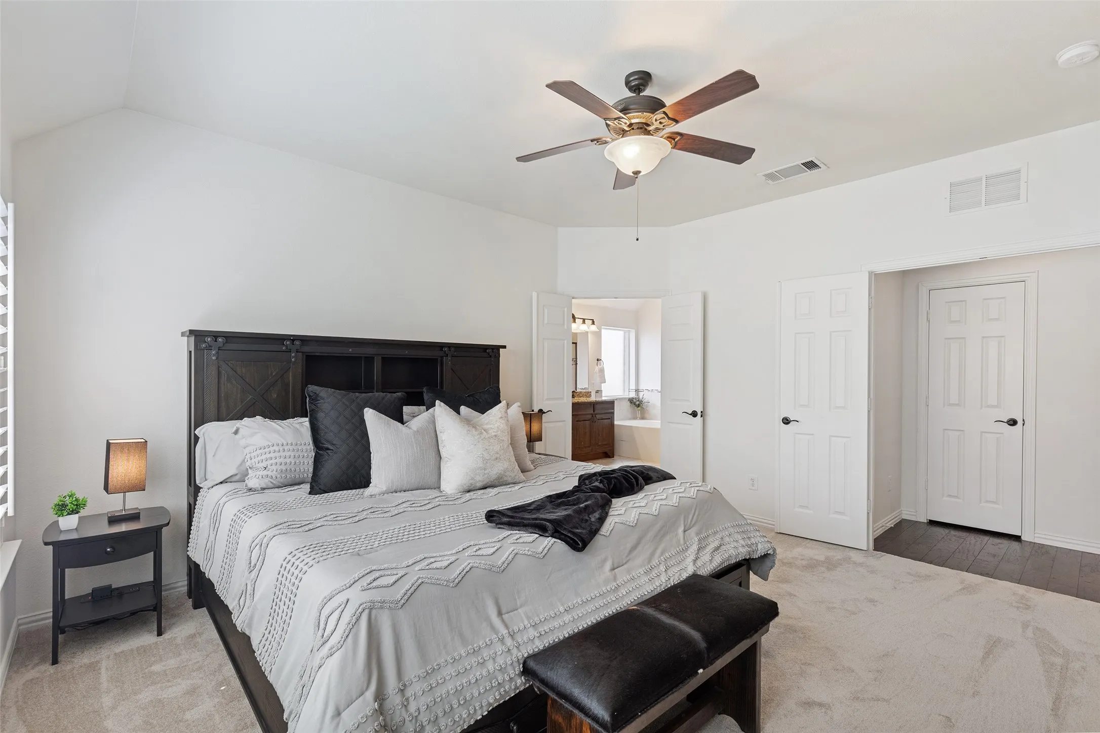 Spacious owner’s suite with direct access to the spa-style bath and oversized closet.