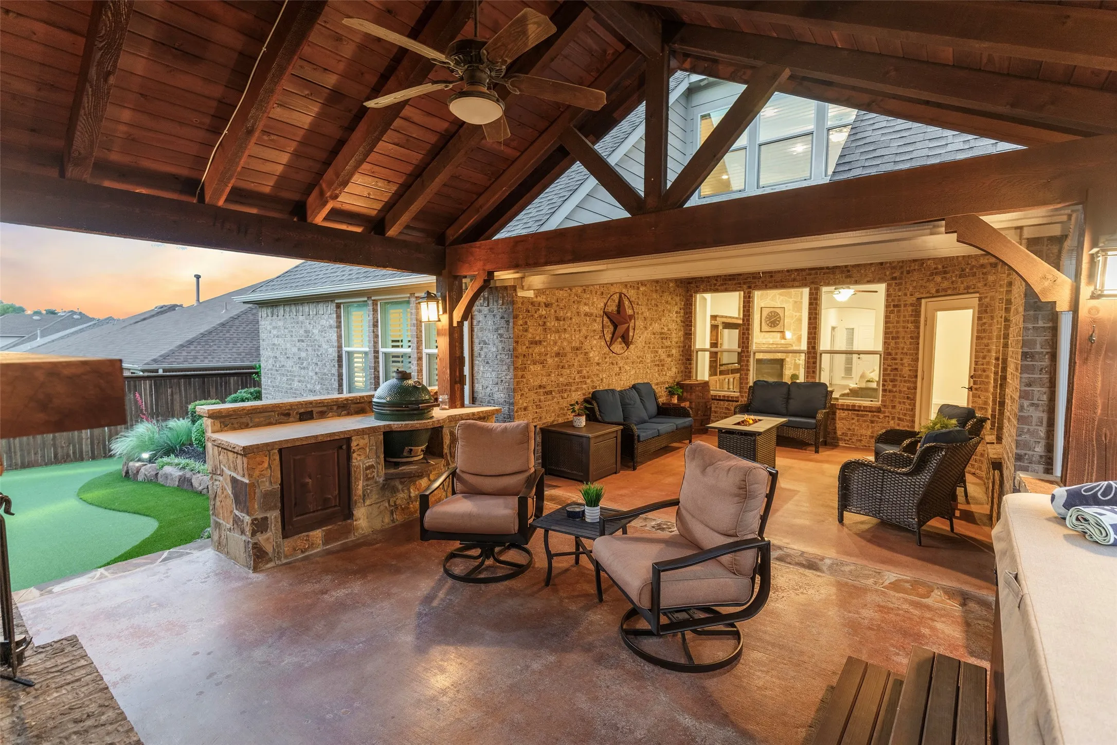 Fully equipped outdoor kitchen with built-in grill and generous prep space, making outdoor dining and entertaining effortless.