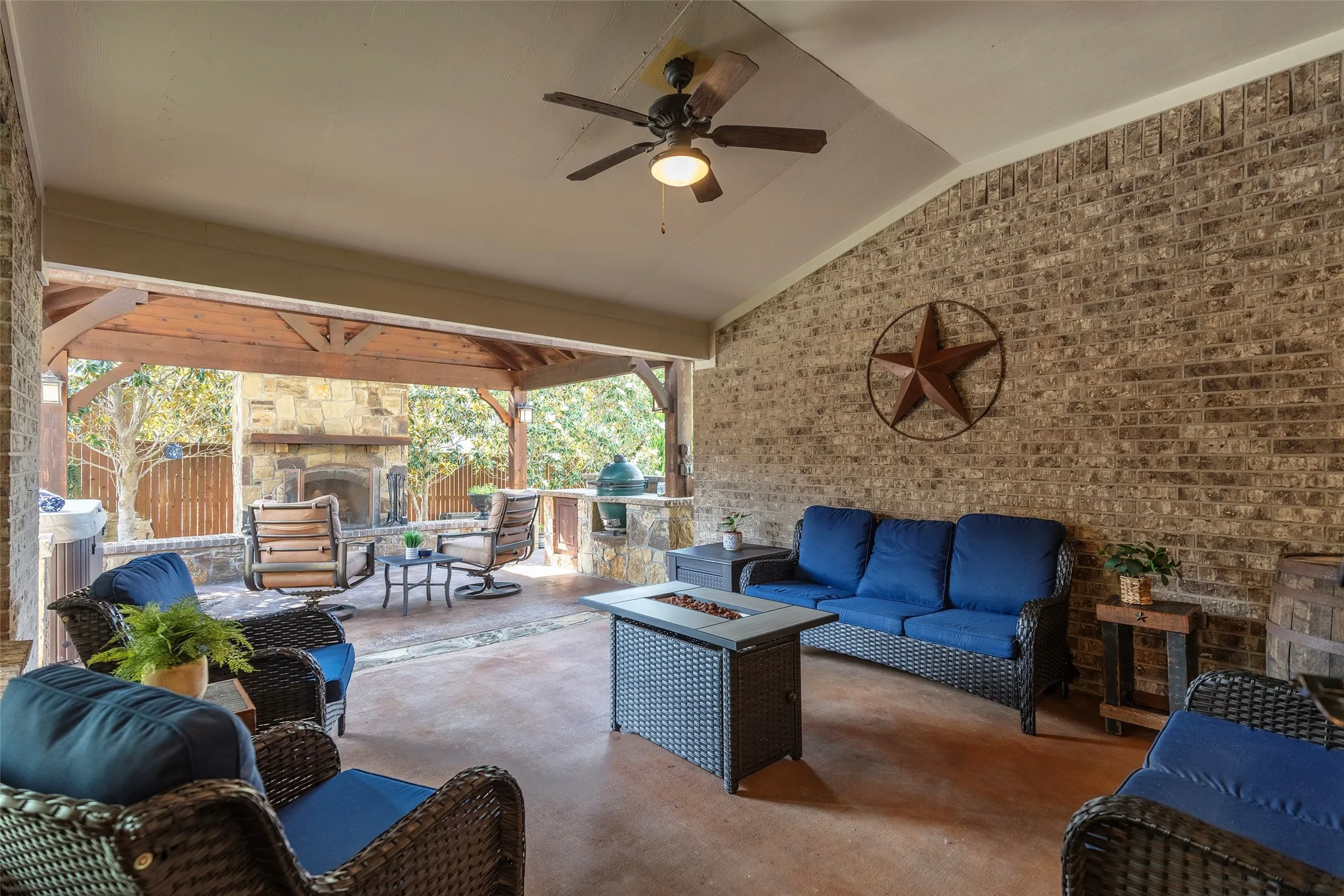 Private backyard retreat with comfortable lounge space and direct access to the outdoor kitchen area.