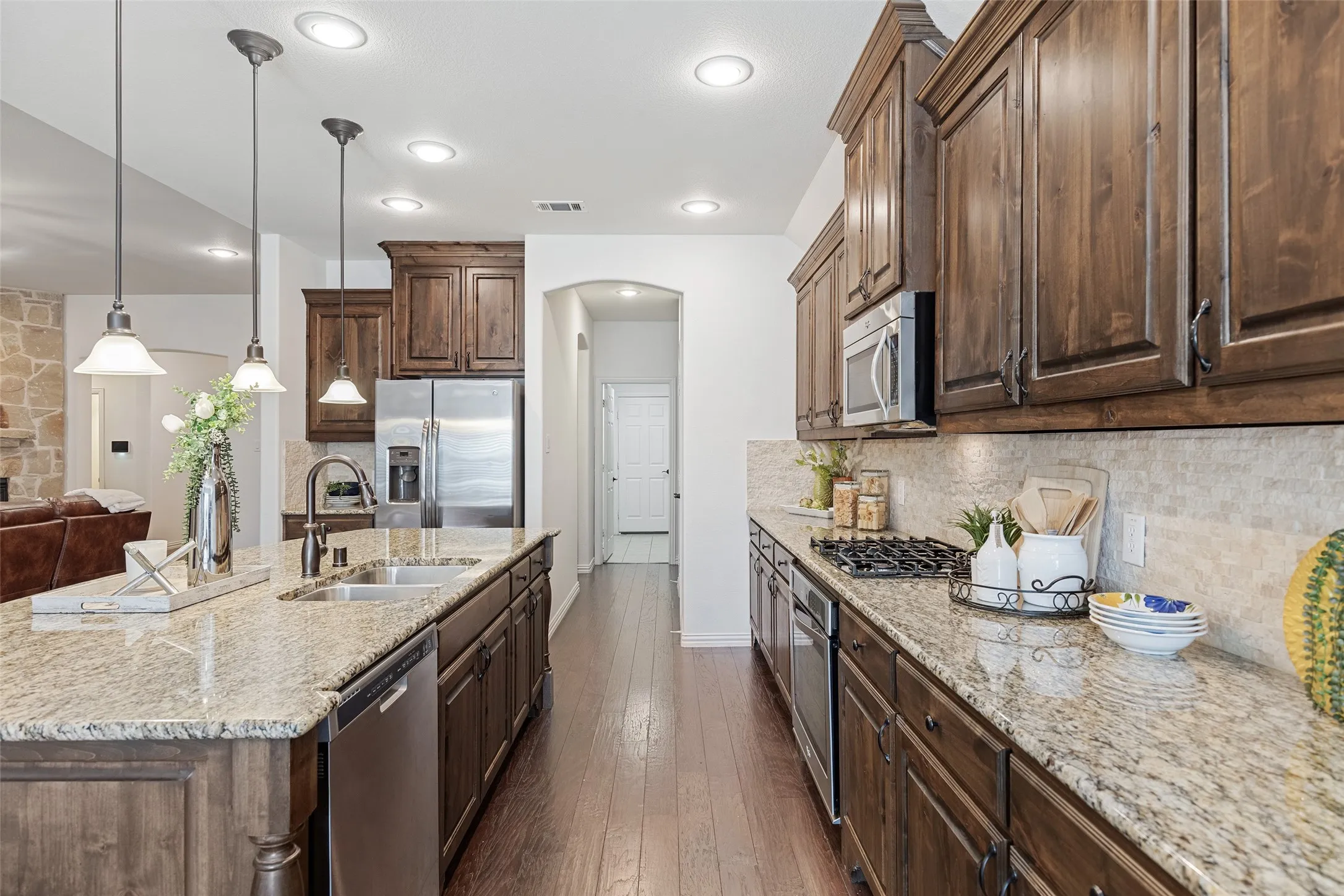 Functional kitchen layout with extensive cabinetry and easy access to the utility area.