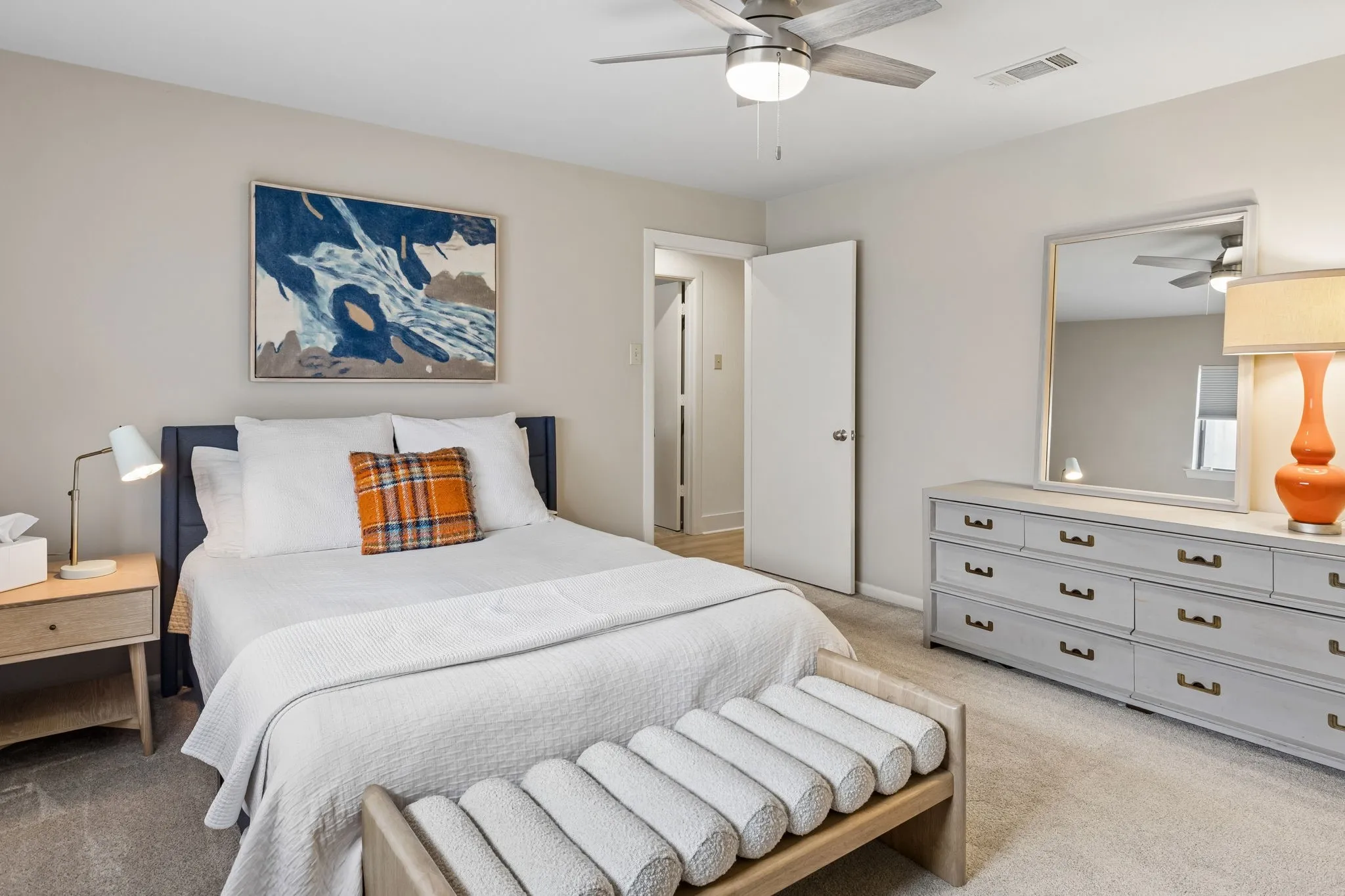 Bedroom featuring light gray wall paint and coordinating carpet