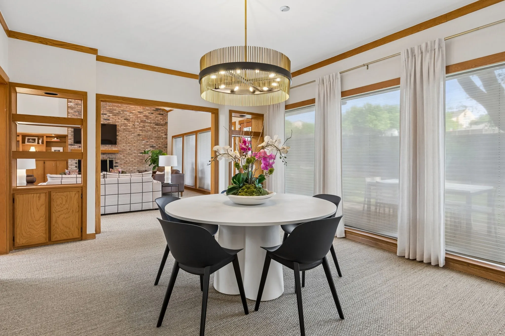 Dining area featuring a contemporary chandelier and expansive window views