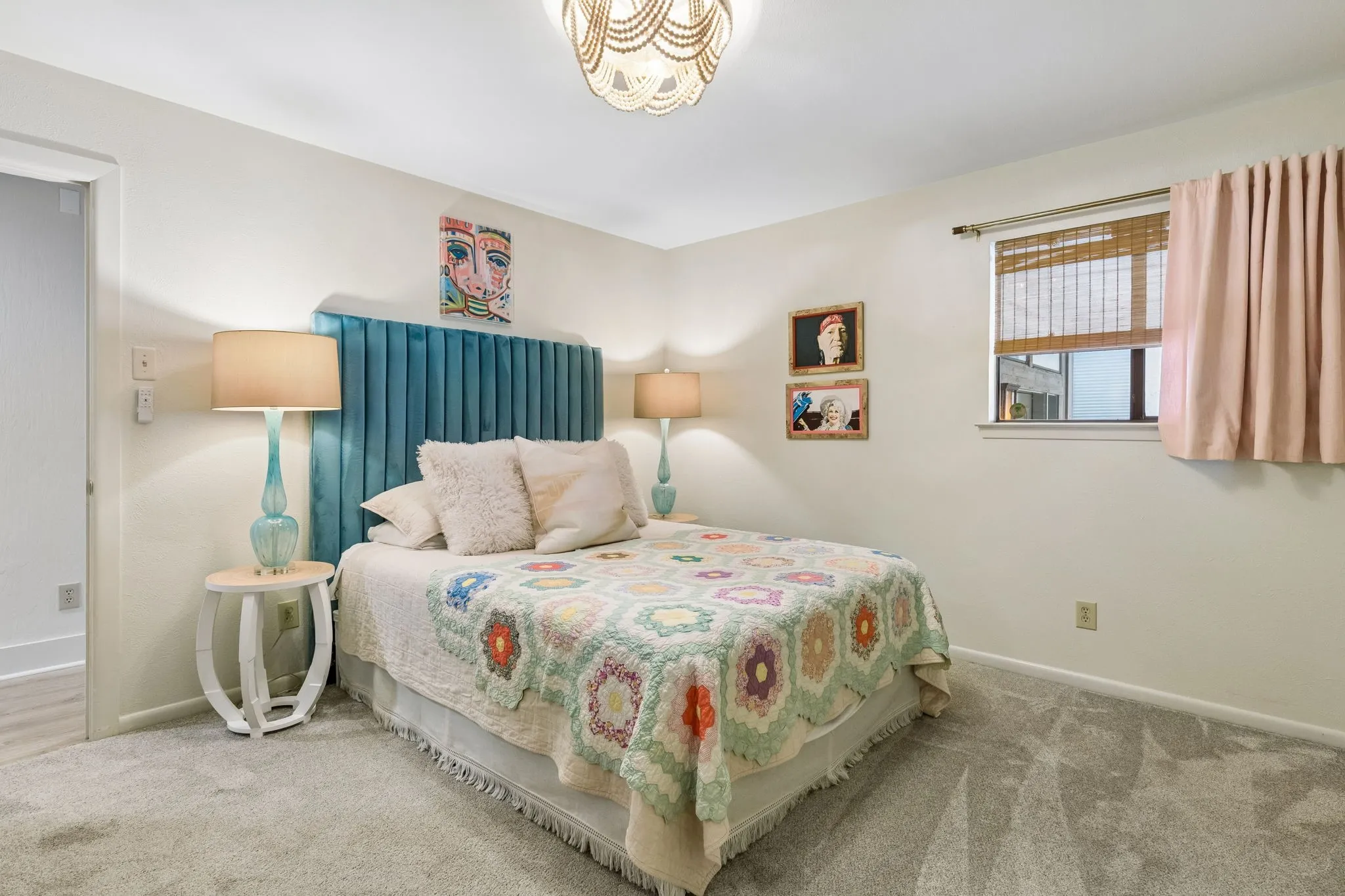 Spacious room featuring light gray carpeting and white painted walls