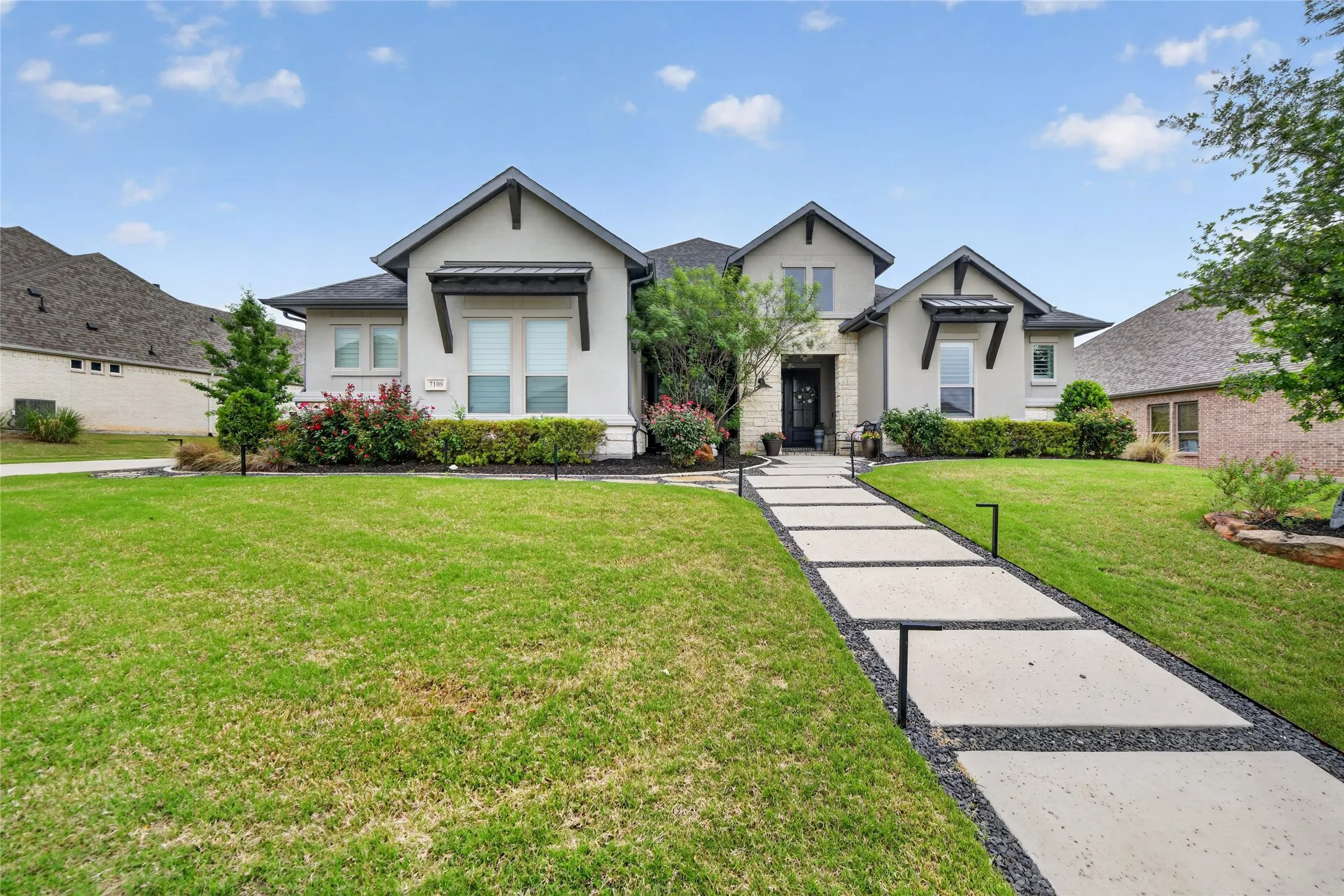 Additional highlights include smart home automation, Jellyfish permanent exterior lighting, and a spacious three-car garage.