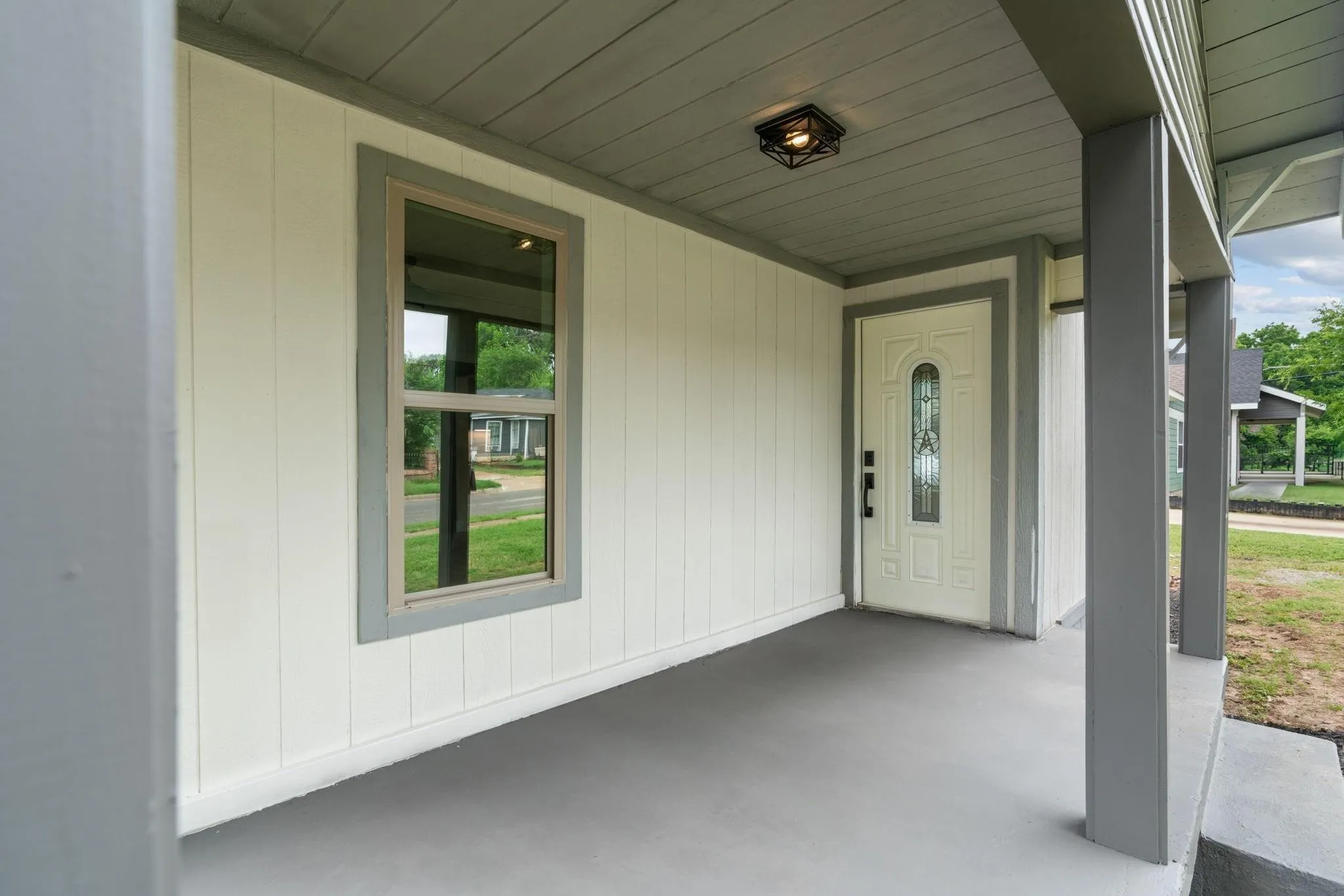 Property entrance with covered porch