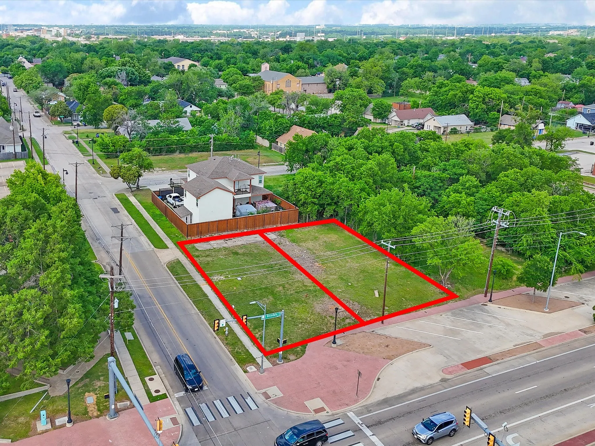 Two undeveloped parcels featuring clear land and street frontage