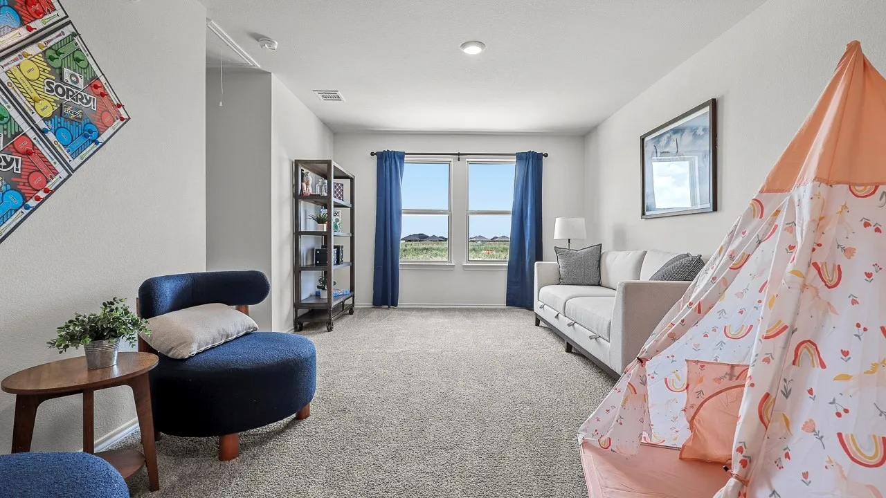 Spacious room featuring light gray carpeting, neutral wall finishes, and recessed lighting