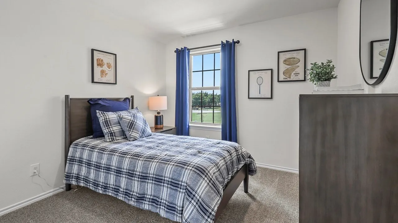 Room featuring neutral wall paint, a window with grid panes, textured carpet flooring, and white baseboards
