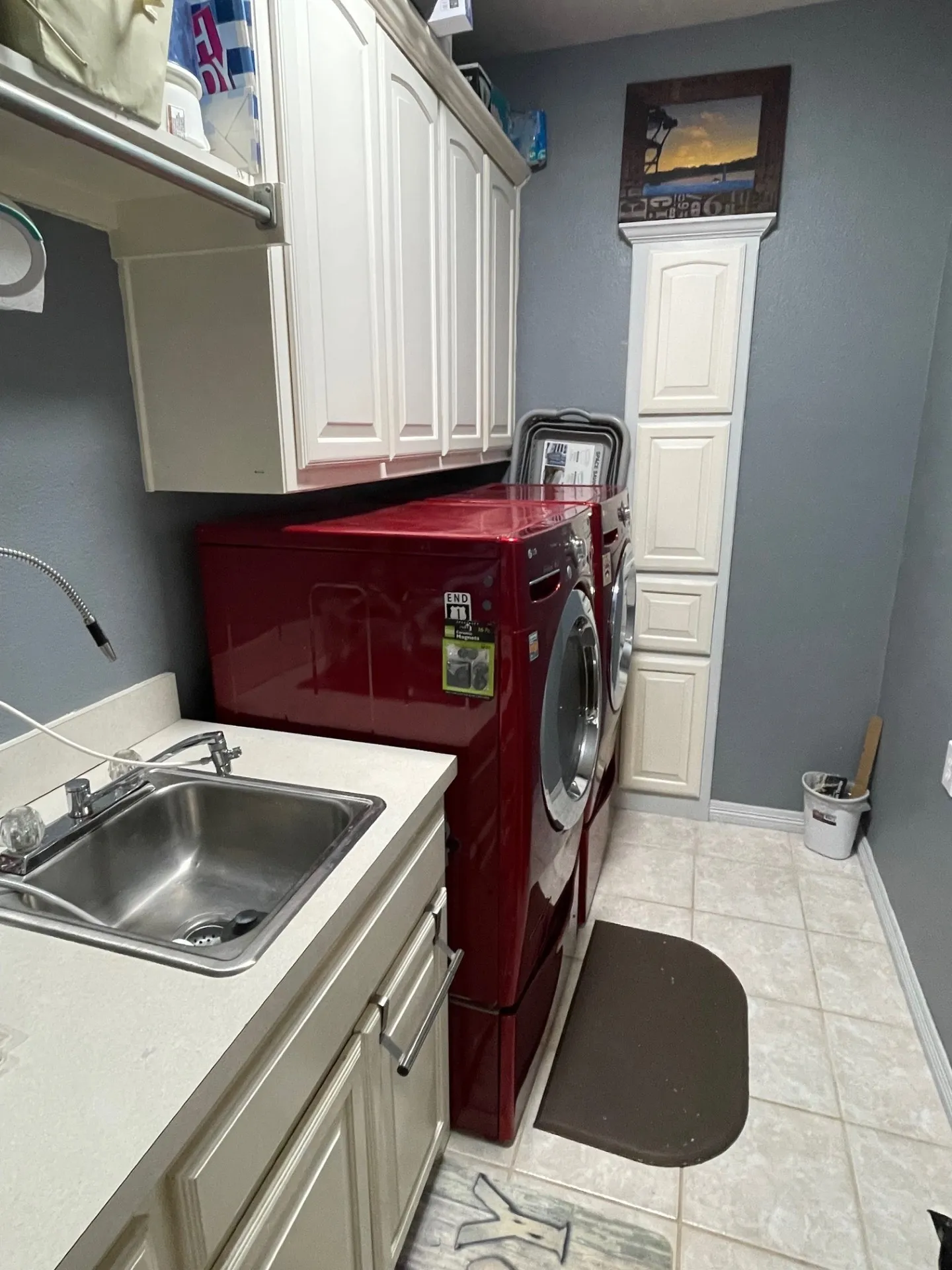 Laundry with sink and chute from primary closet