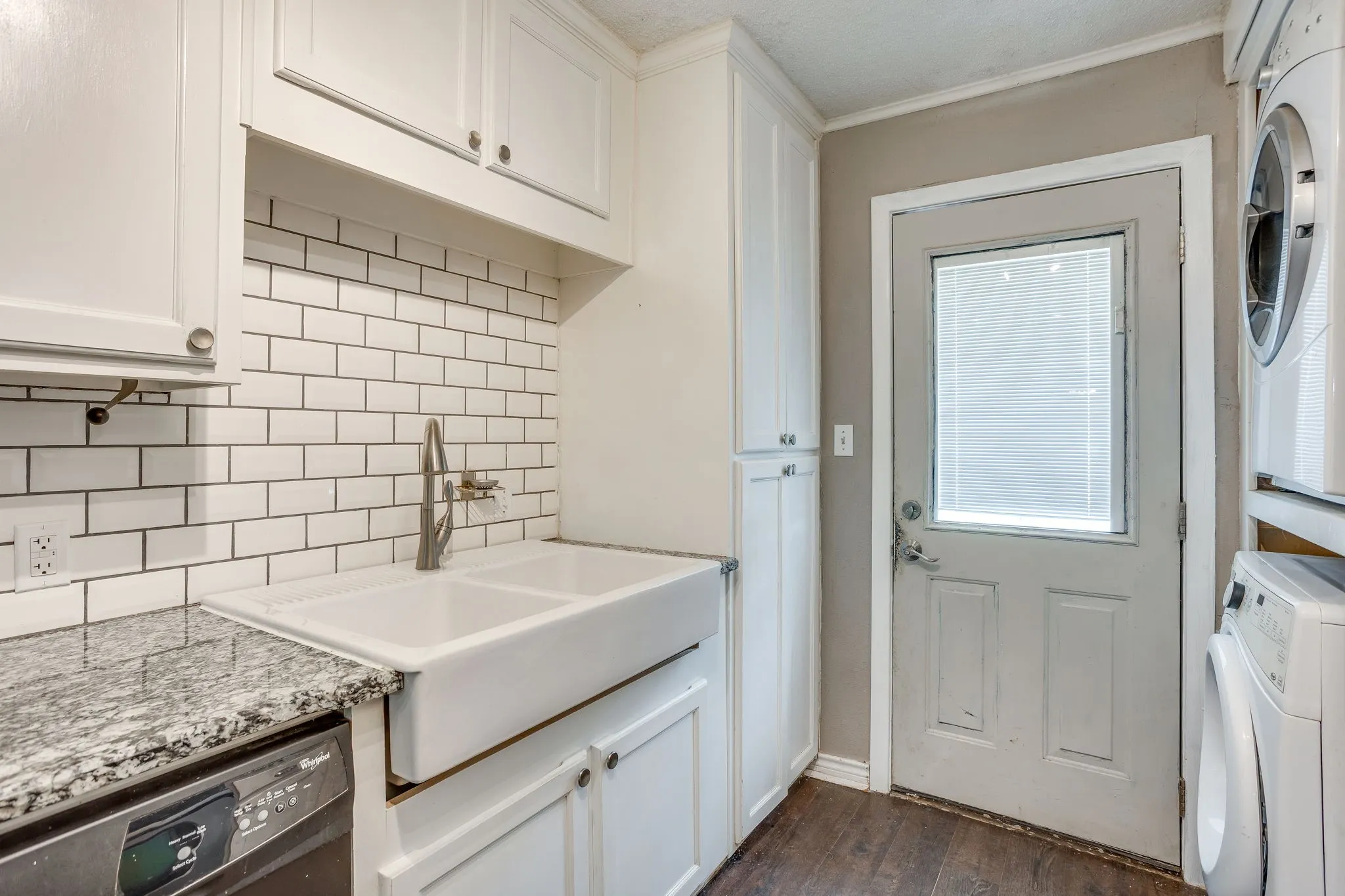 Farmhouse sink and subway tiled backsplash