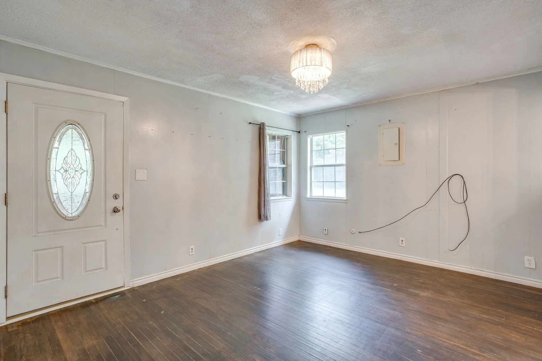 Primary bedroom with door to the enclosed porch