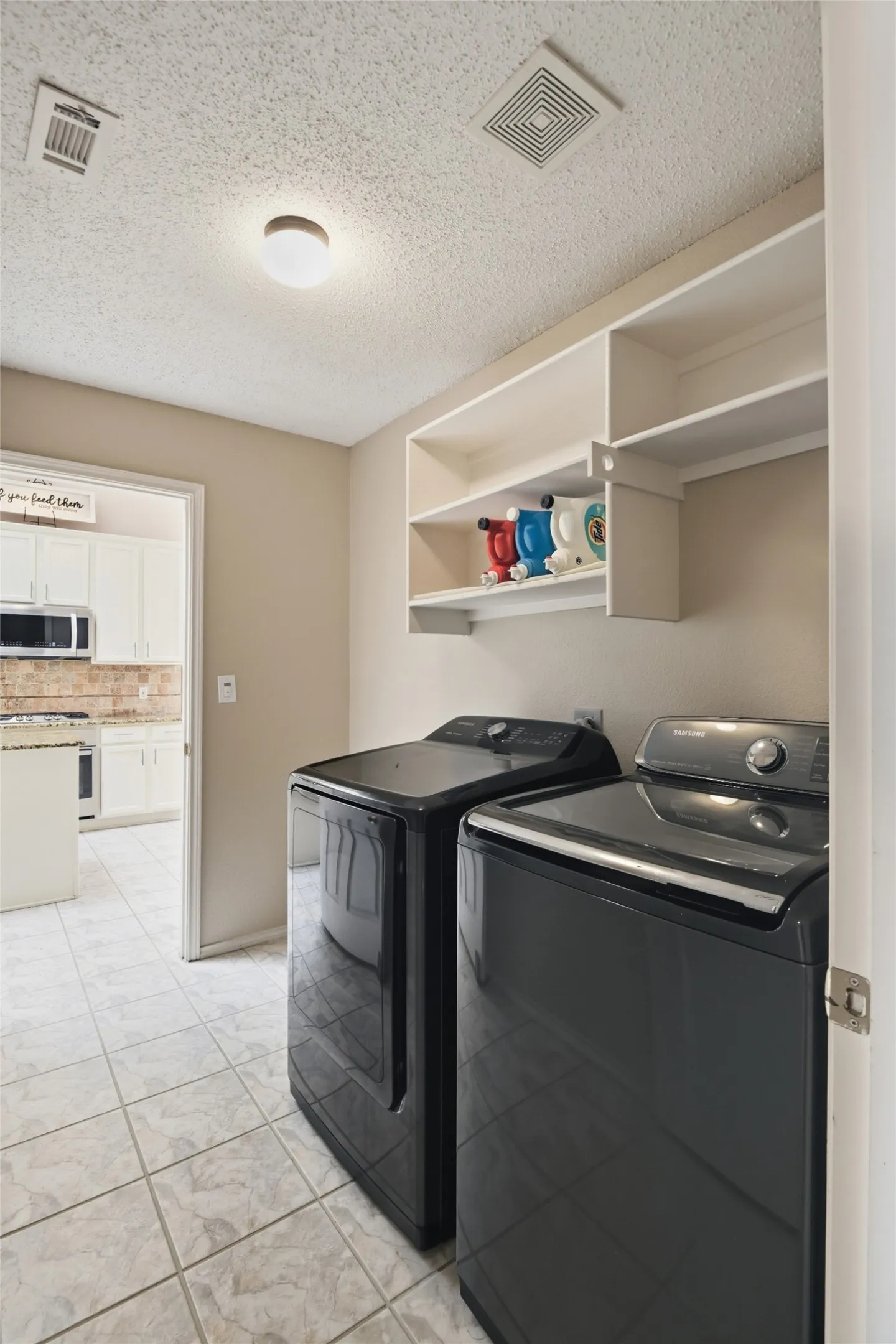 Utility room with plumbing in place for a sink.