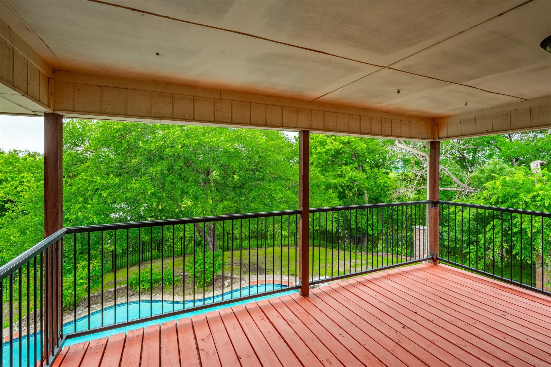 Balcony overlooking the pool and lake.