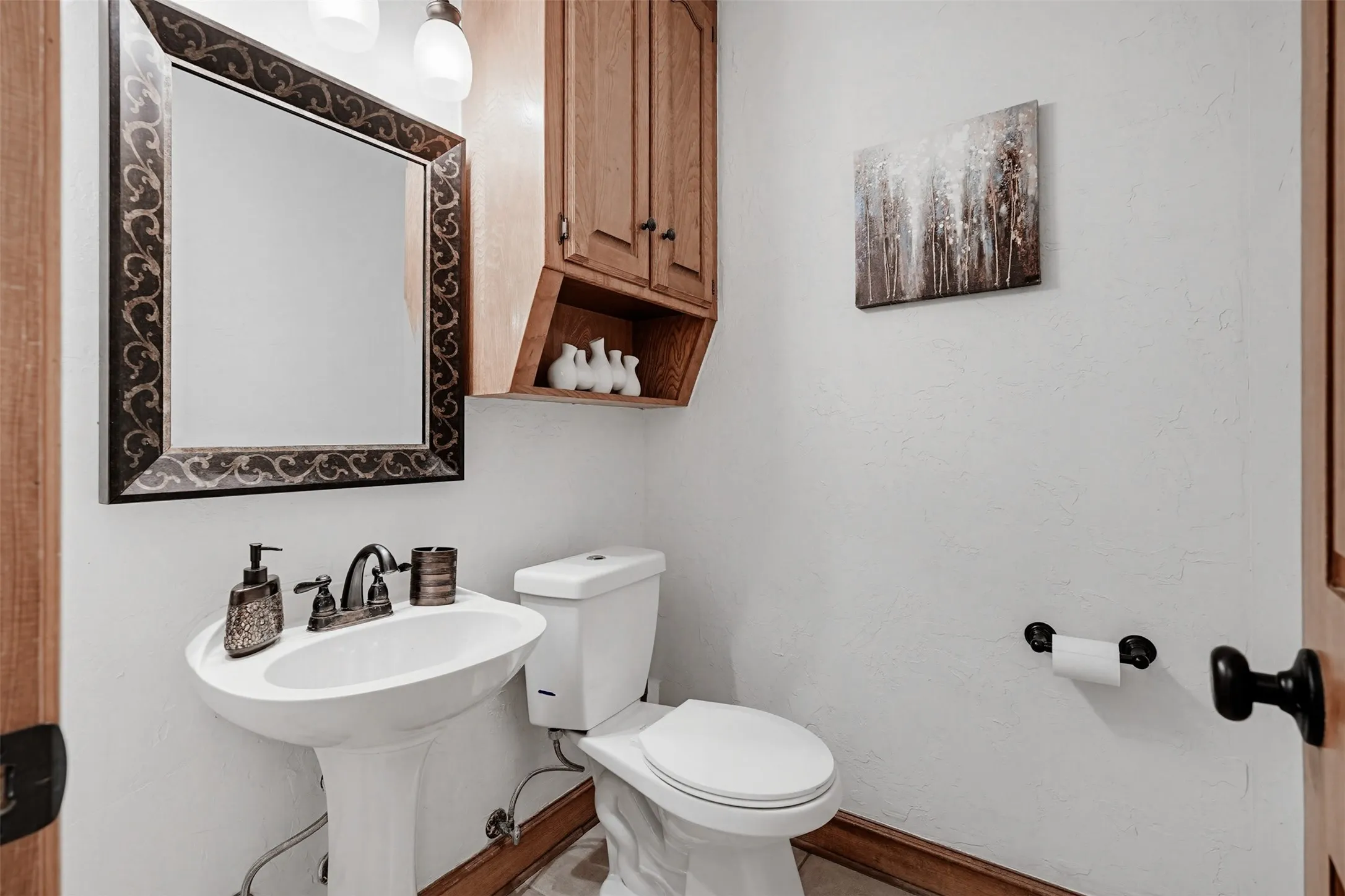 Half bath near the back door to the pool area.