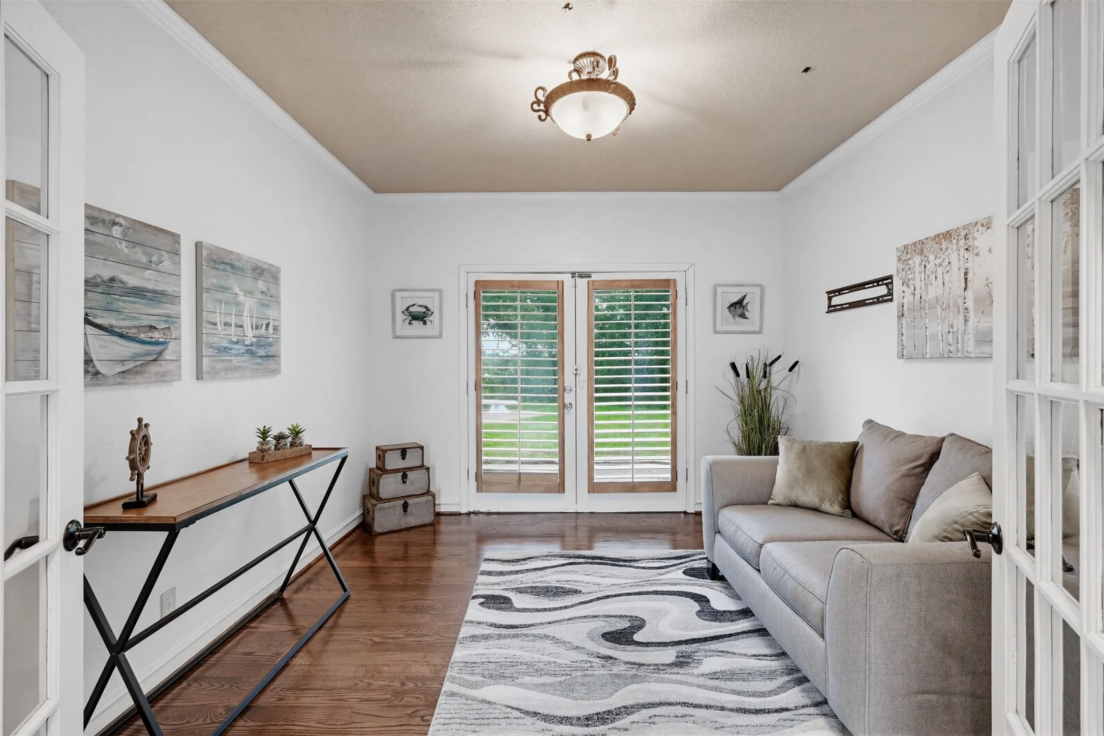 Office with double French doors leading to patio.