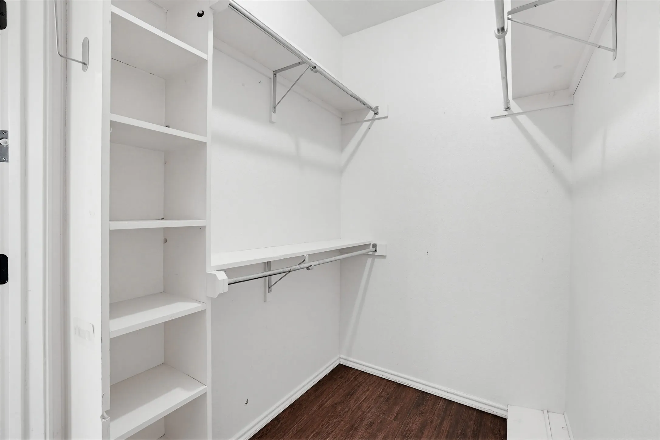 Walk in closet in primary bath, another same sized one is on the other side of the tub.