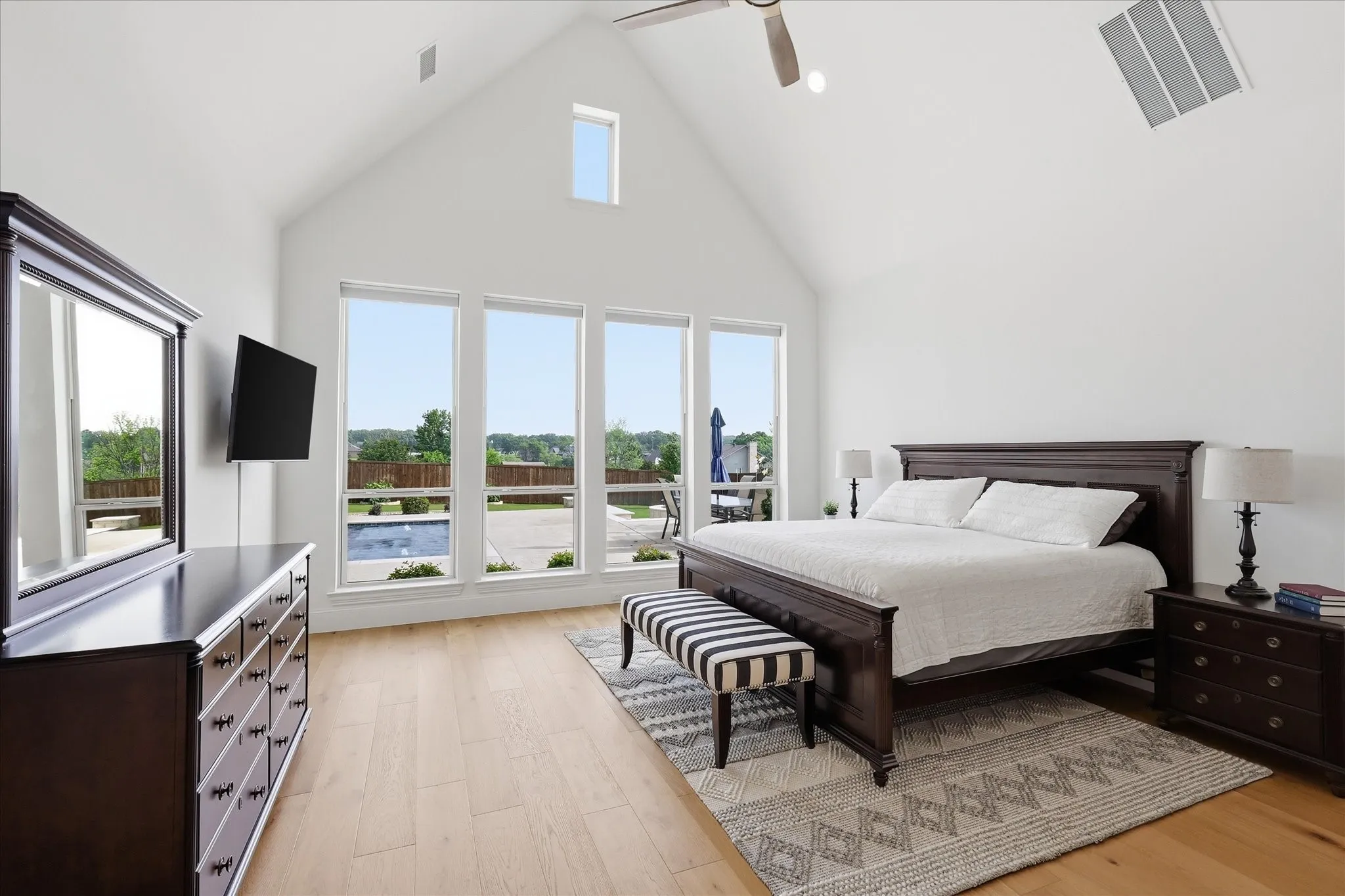 Vaulted ceilings with a window dormer and ceiling fan