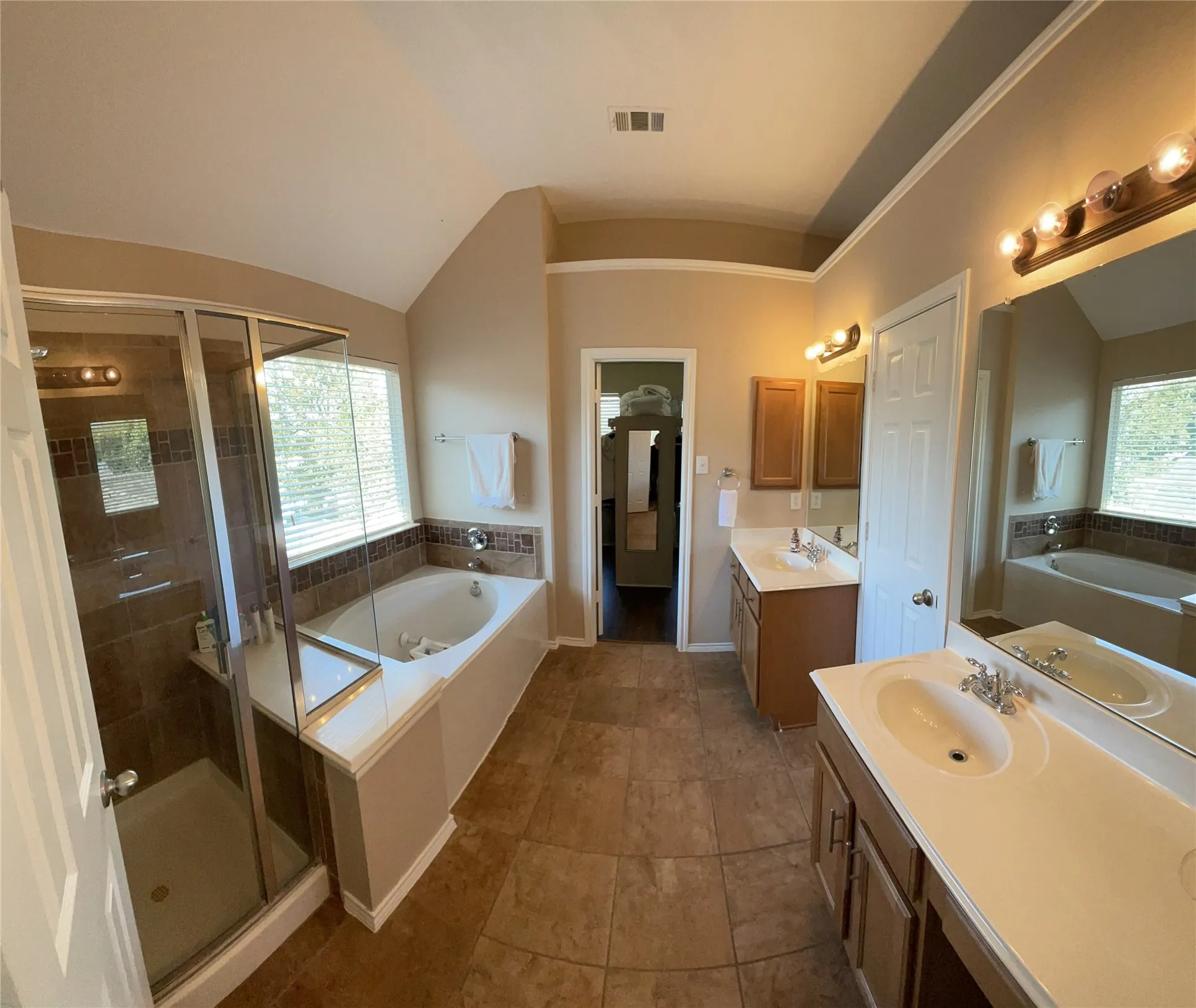 Master bath with stand alone shower and a  soaking tub