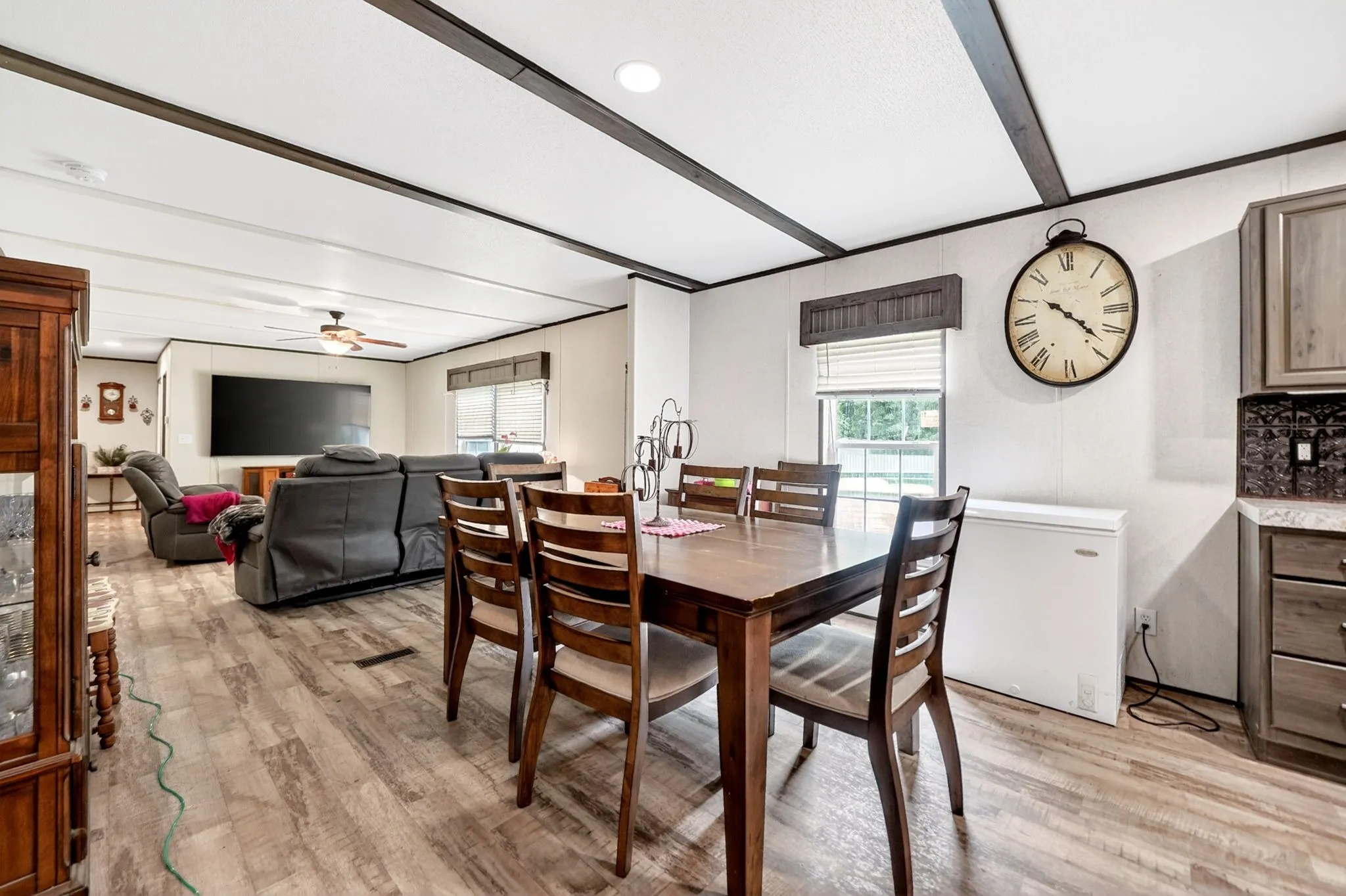 Open concept living space featuring wood-finish flooring throughout