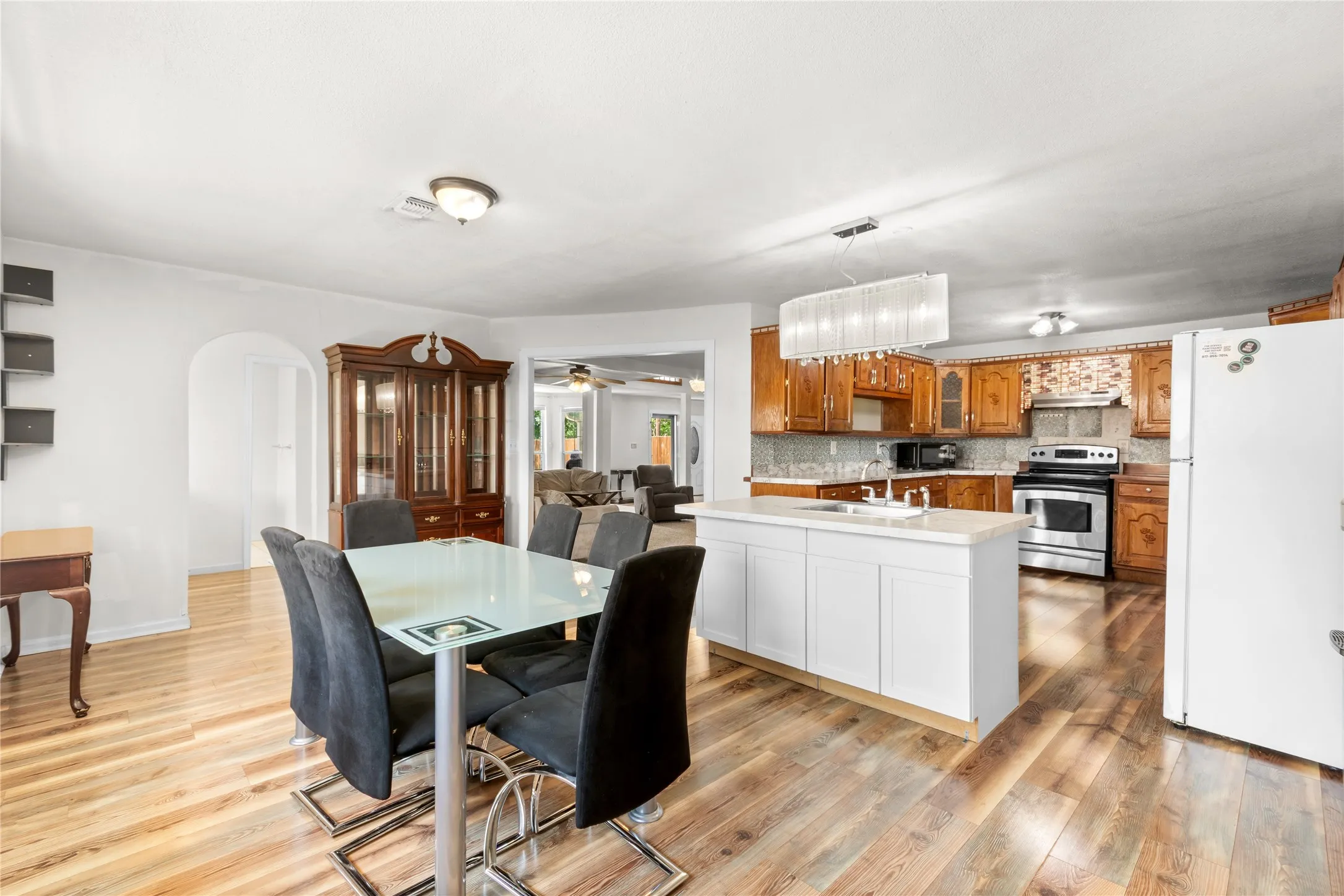 Open concept living area featuring wood-finish flooring