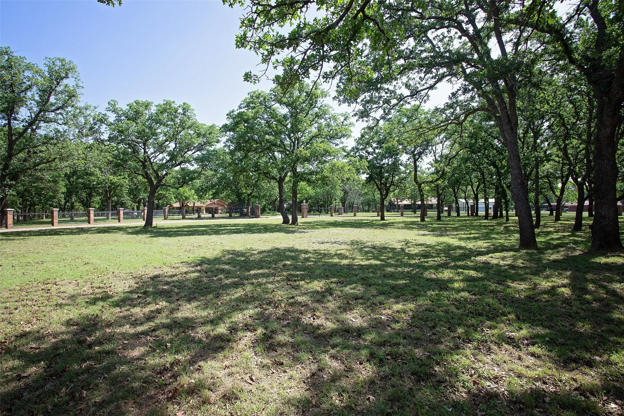 Set on a beautifully treed homesite, this property offers a rare combination of privacy and curb appeal with an impressive canopy of mature hardwoods that create shade, character, and a true sense of place.