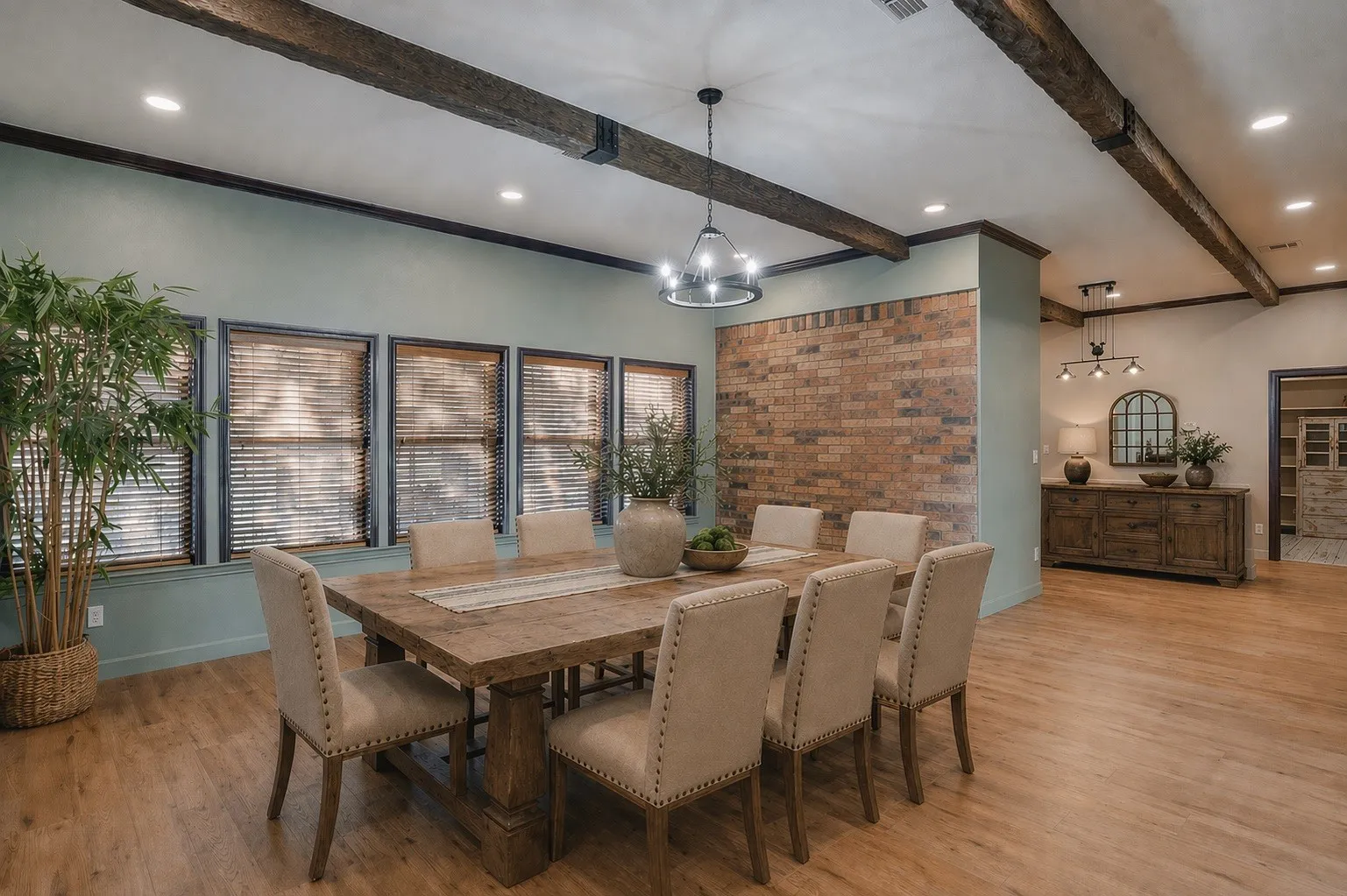VIRTUALLY STAGED: Bright, window-lined space filled with natural light and direct access to the covered front patio through sliding glass doors. Open to the kitchen, this versatile area offers flexibility as a Dininig Room, all while taking advantage of the expansive windows and inviting layout.