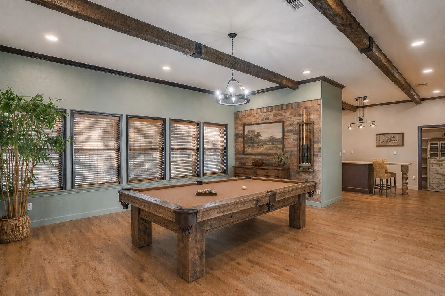 VIRTUALLY STAGED: Bright, window-lined space filled with natural light and direct access to the covered front patio through sliding glass doors. Open to the kitchen, this versatile area offers flexibility as a family room, all while taking advantage of the expansive windows and inviting layout.