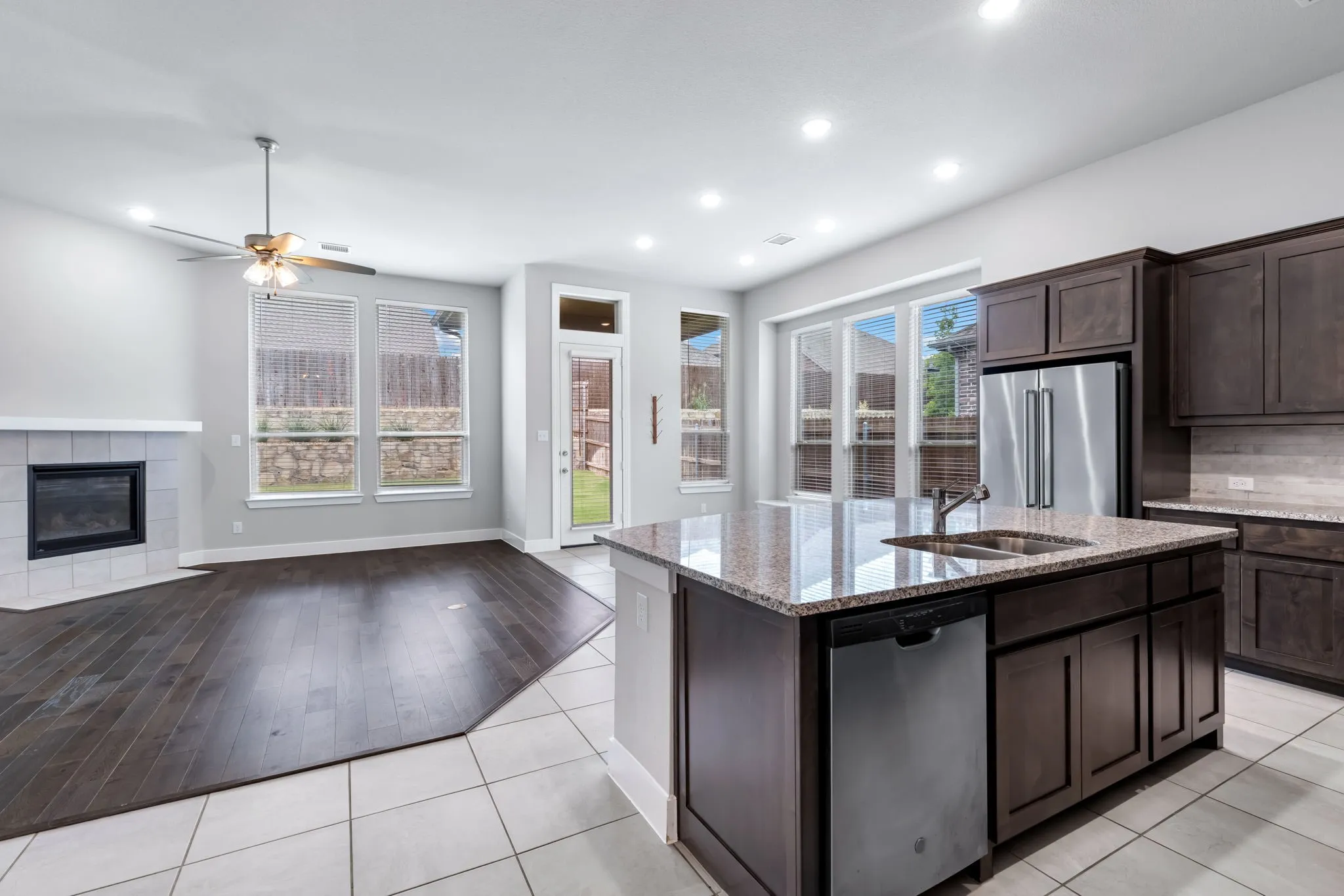 Kitchen island with granite countertop and stainless steel sink