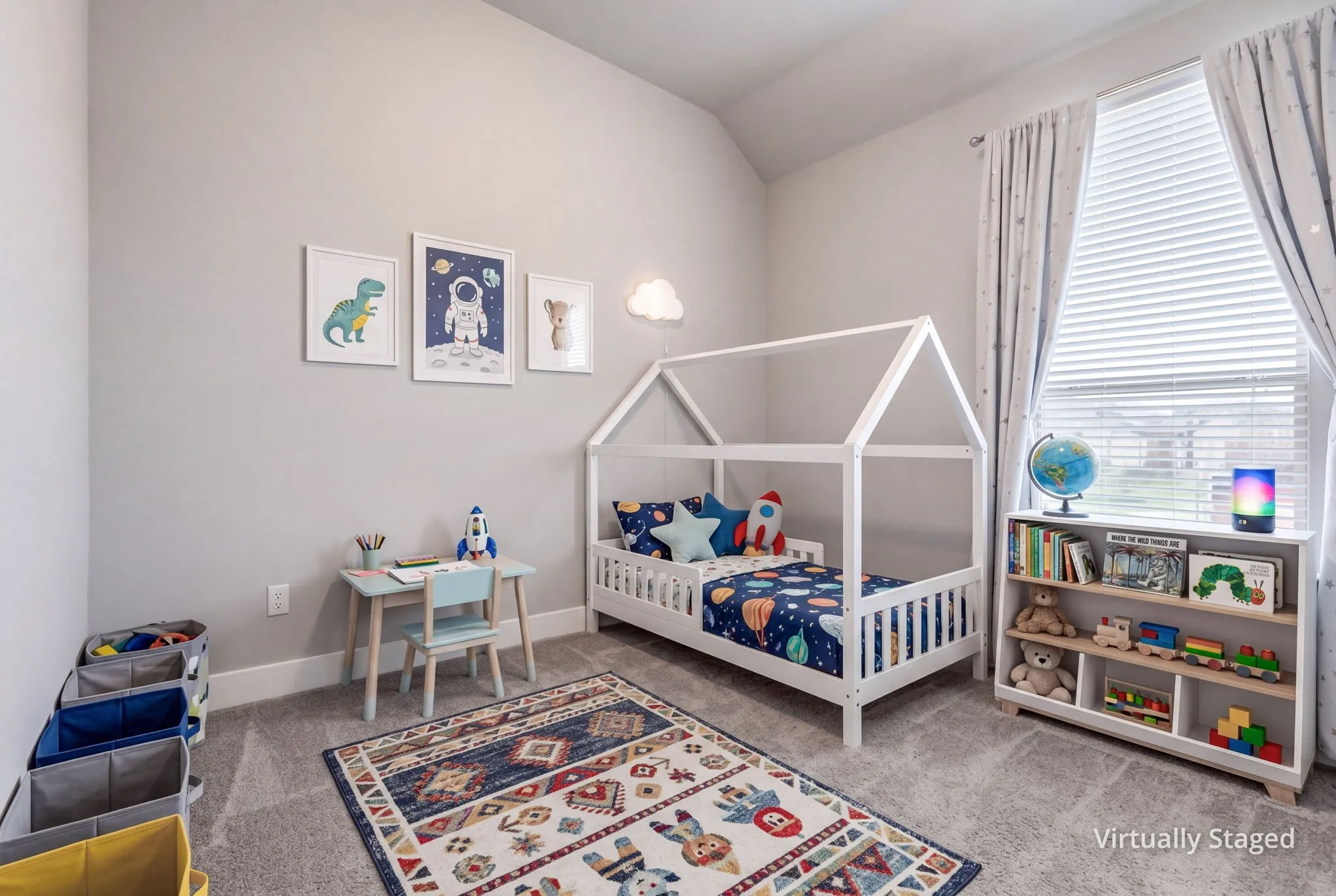 Room featuring light gray walls, gray carpet flooring, a vaulted ceiling, and a large window with white blinds and patterned curtains