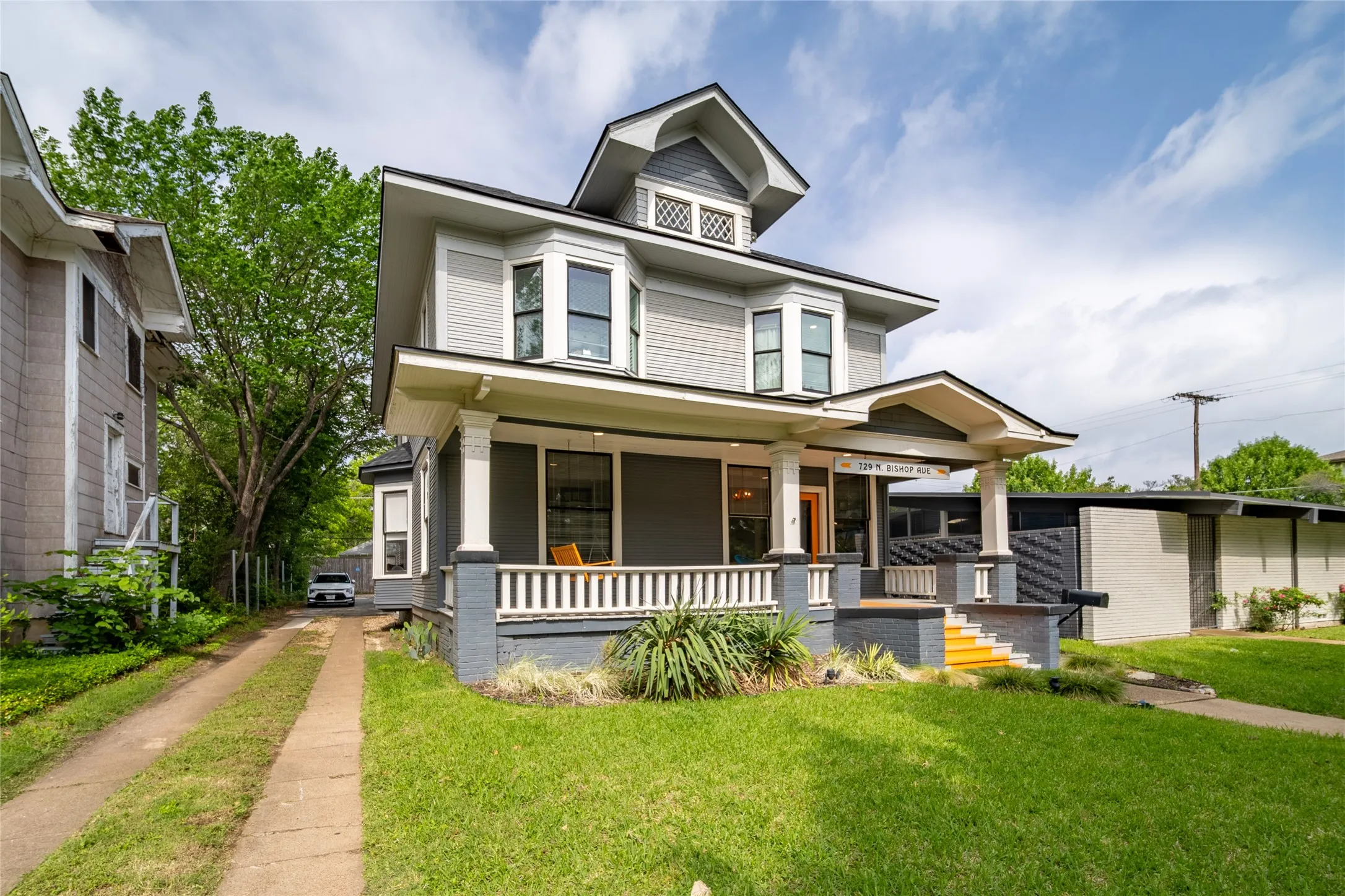 The back parking lot can be accessed from a front driveway or through the back alley.