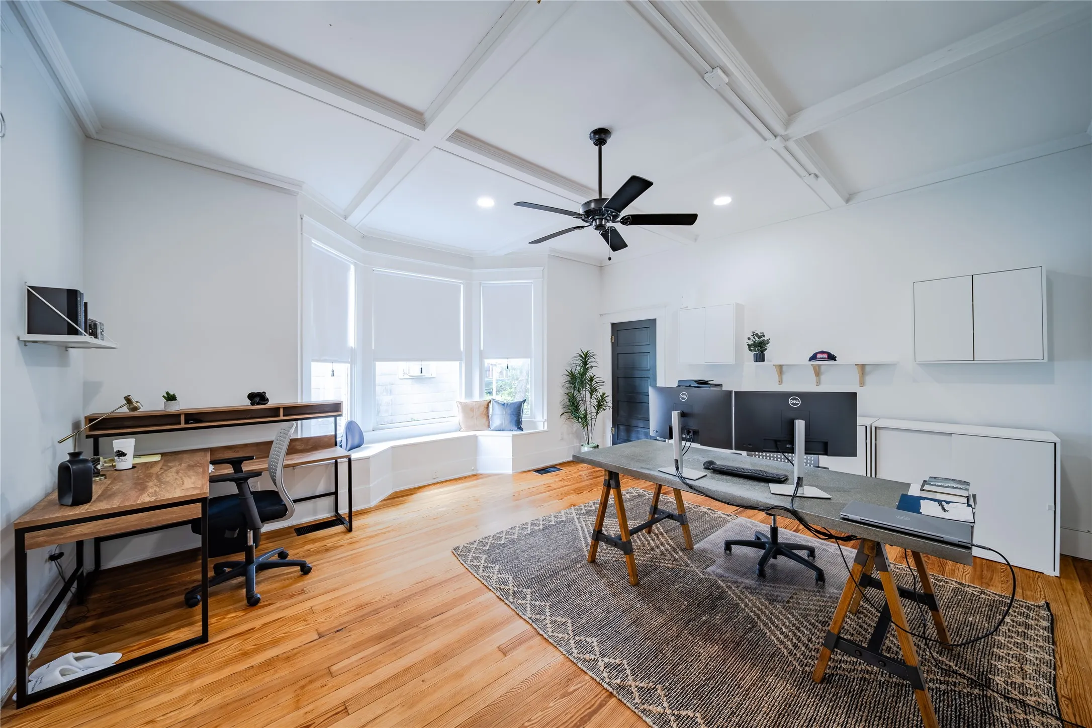 The third office space on the first level features a large storage closet.