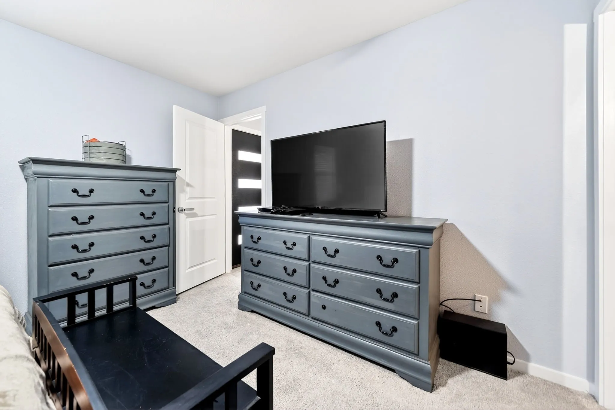 Light-colored walls featuring a white trim