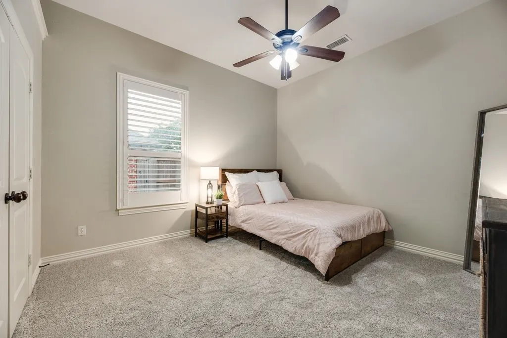 Bedroom 3: Light gray carpet flooring complementing neutral wall tones