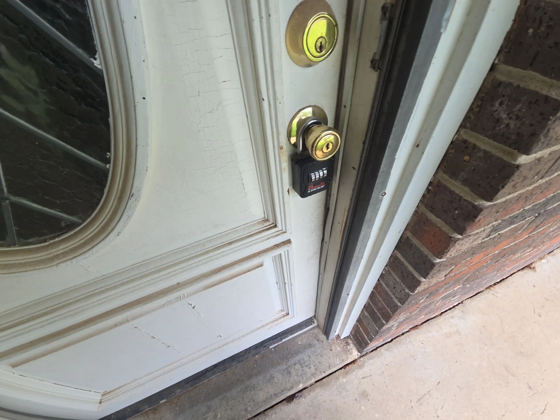 Entry door with decorative glass insert and brass hardware