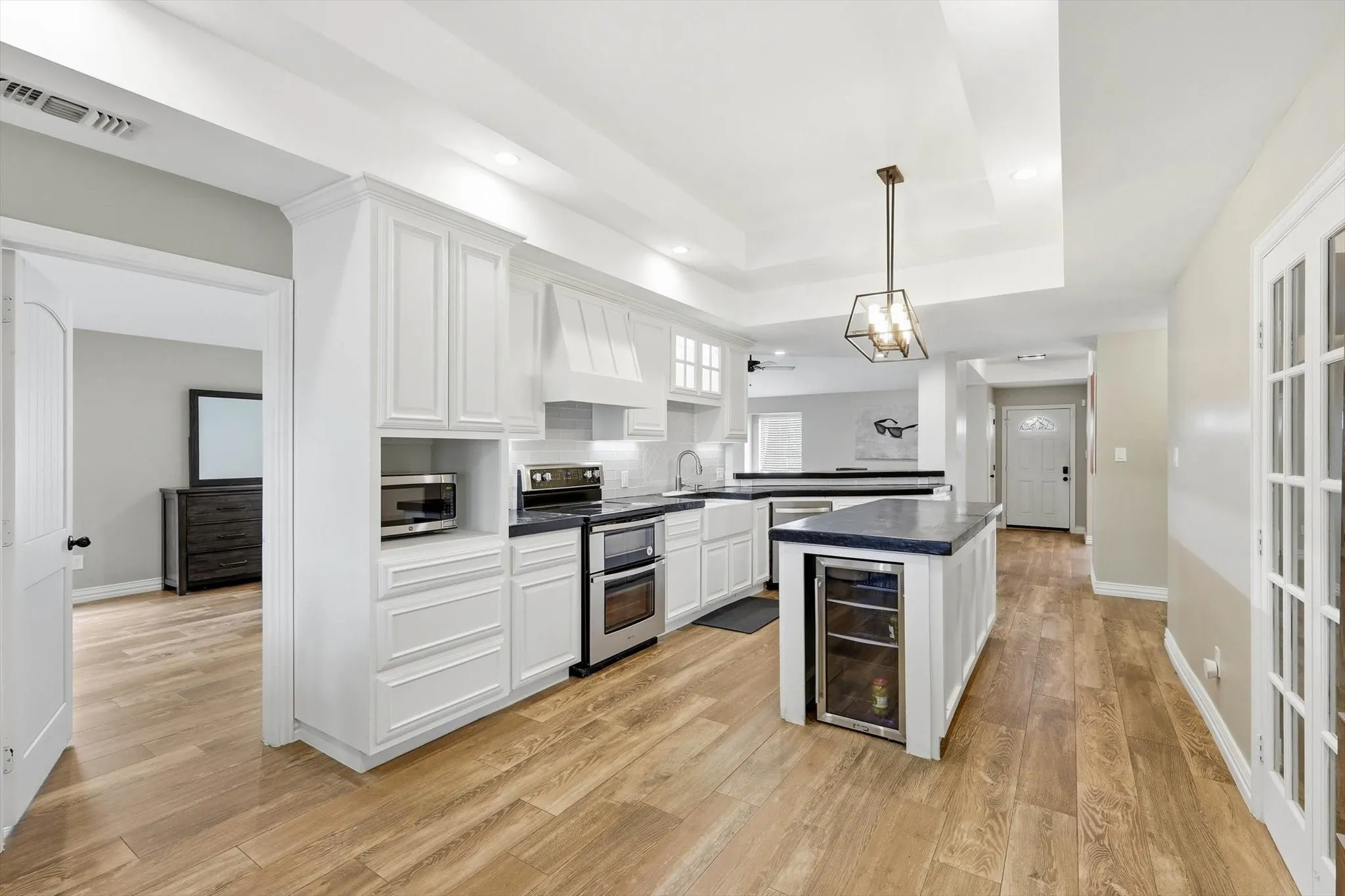 This beautifully updated kitchen combines style and function with generous prep space, custom cabinetry, and an open layout that keeps everyone connected.
