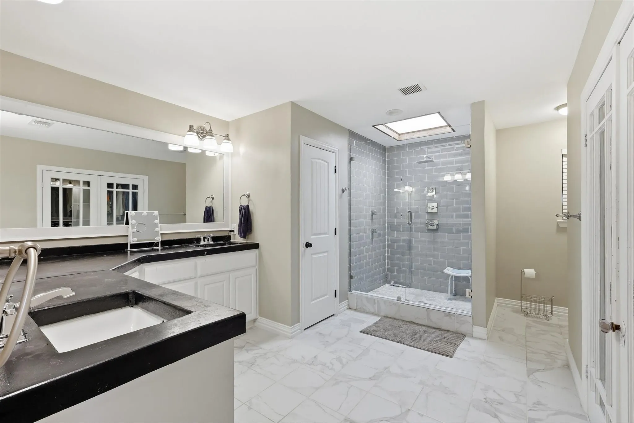 Enjoy spa-like comfort every day with a spacious walk-in shower, modern finishes, and a bathroom designed for both luxury and functionality.
