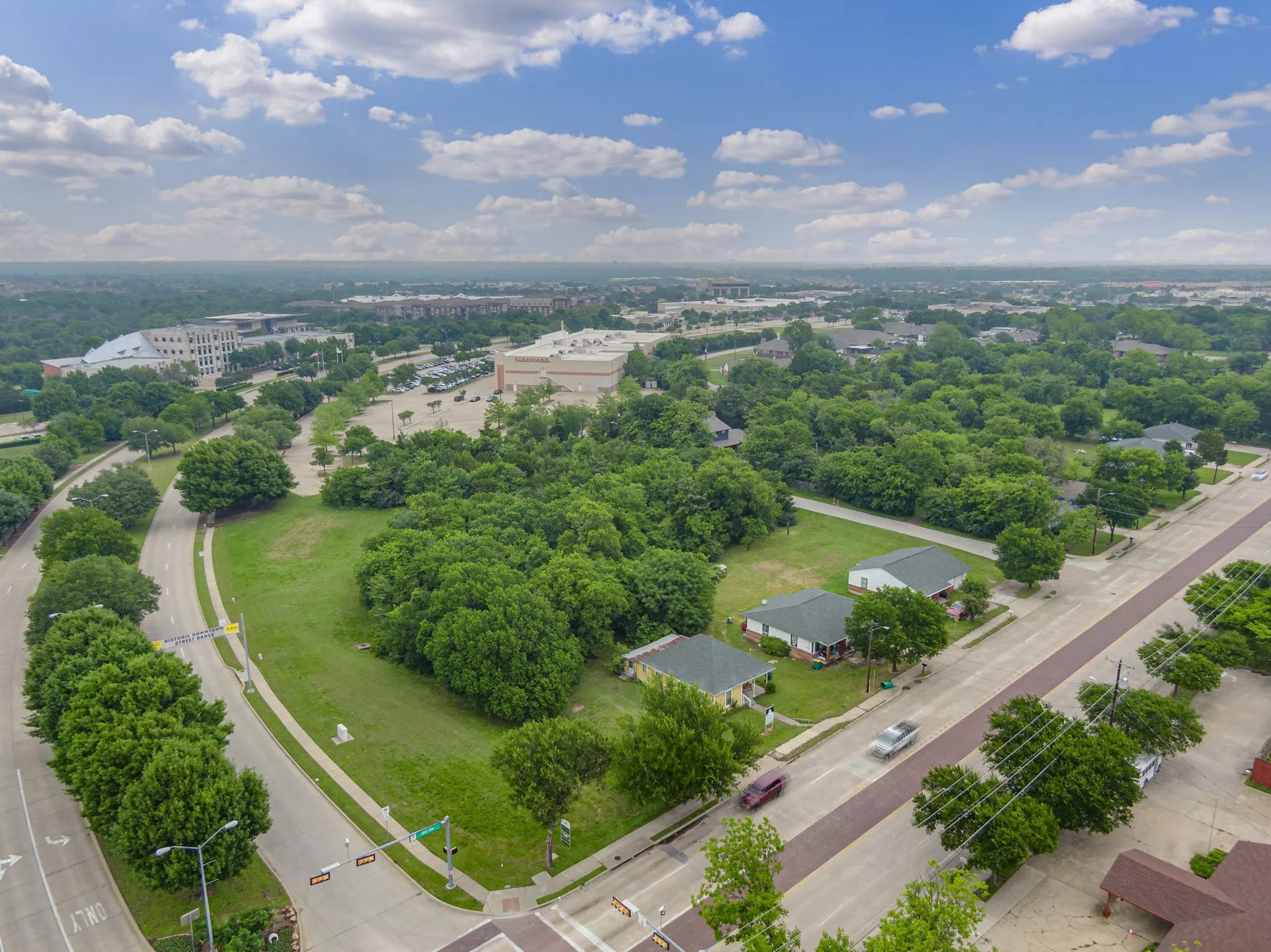 Expansive urban lot featuring mature trees and street frontage