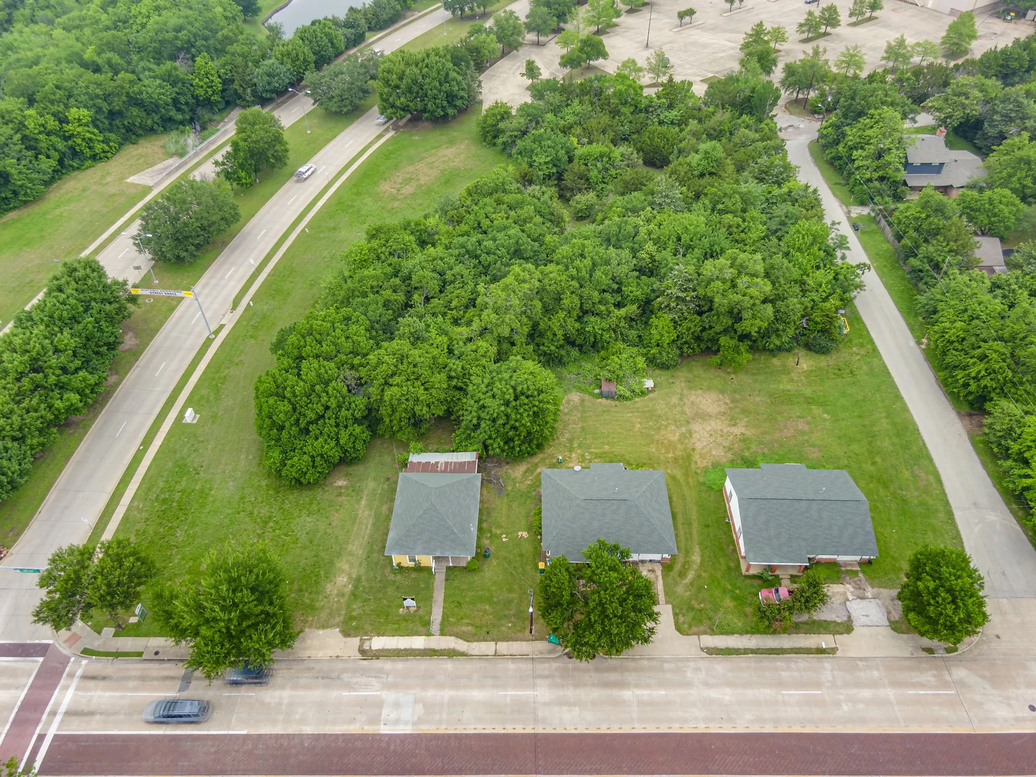 Aerial perspective showcasing multiple properties with green roofs