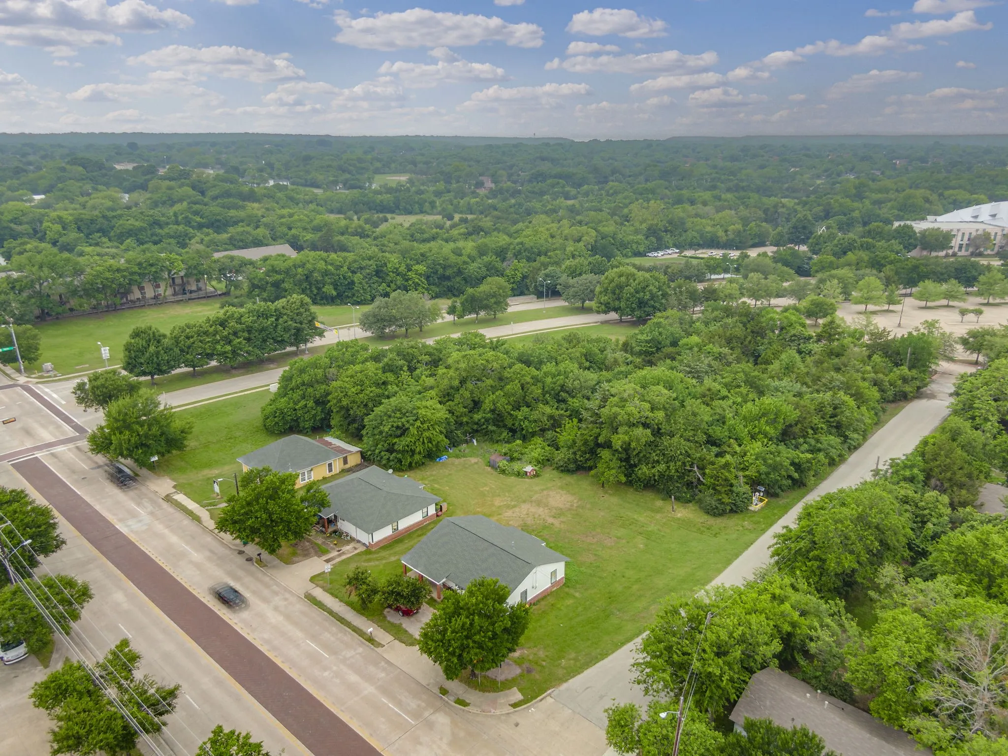 Expansive lot featuring mature trees and green spaces