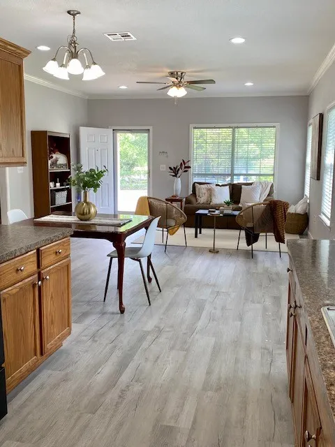 View of dining and living areas from kitchen